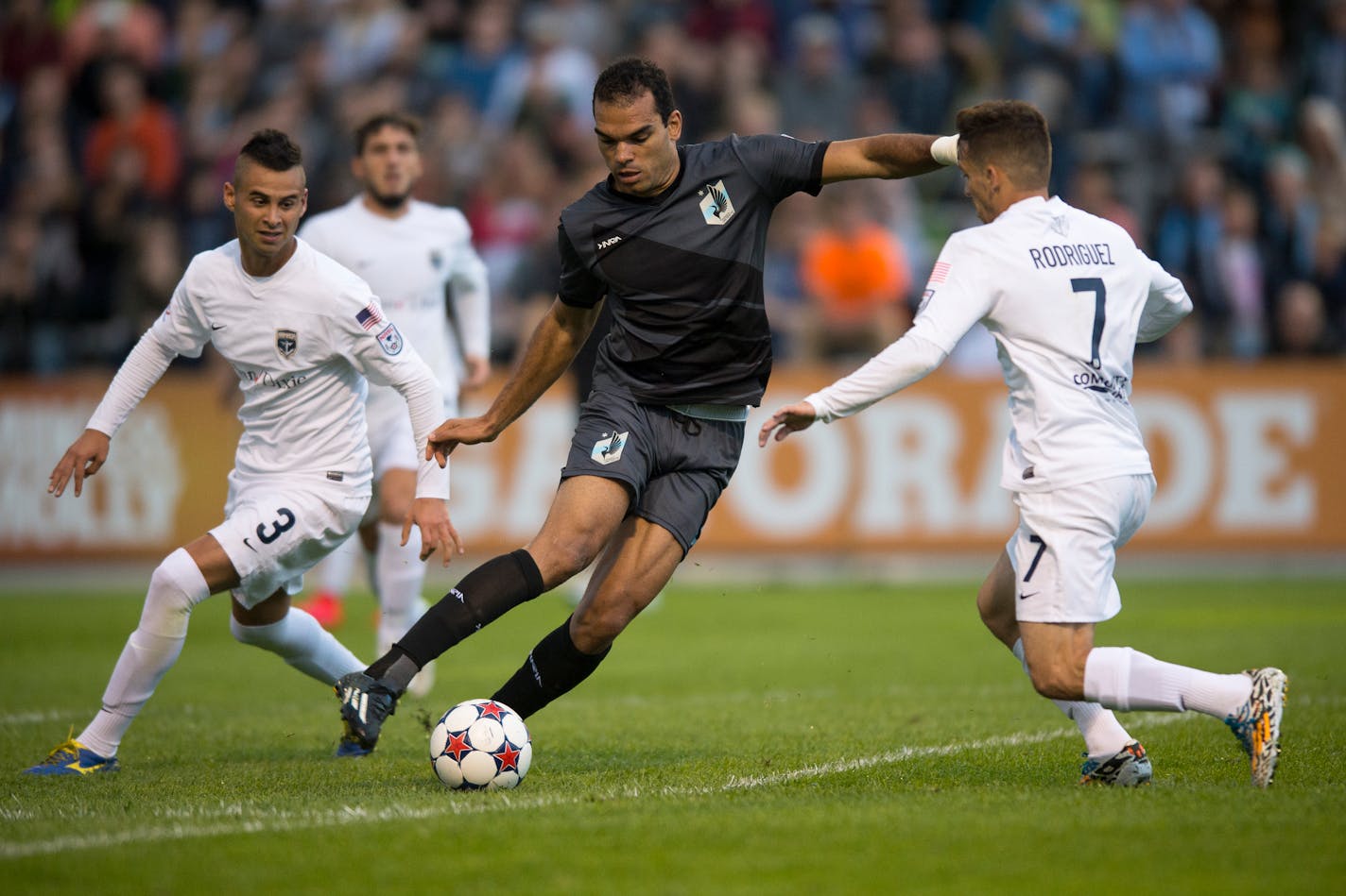 Minnesota United FC's Pablo Campos, center.