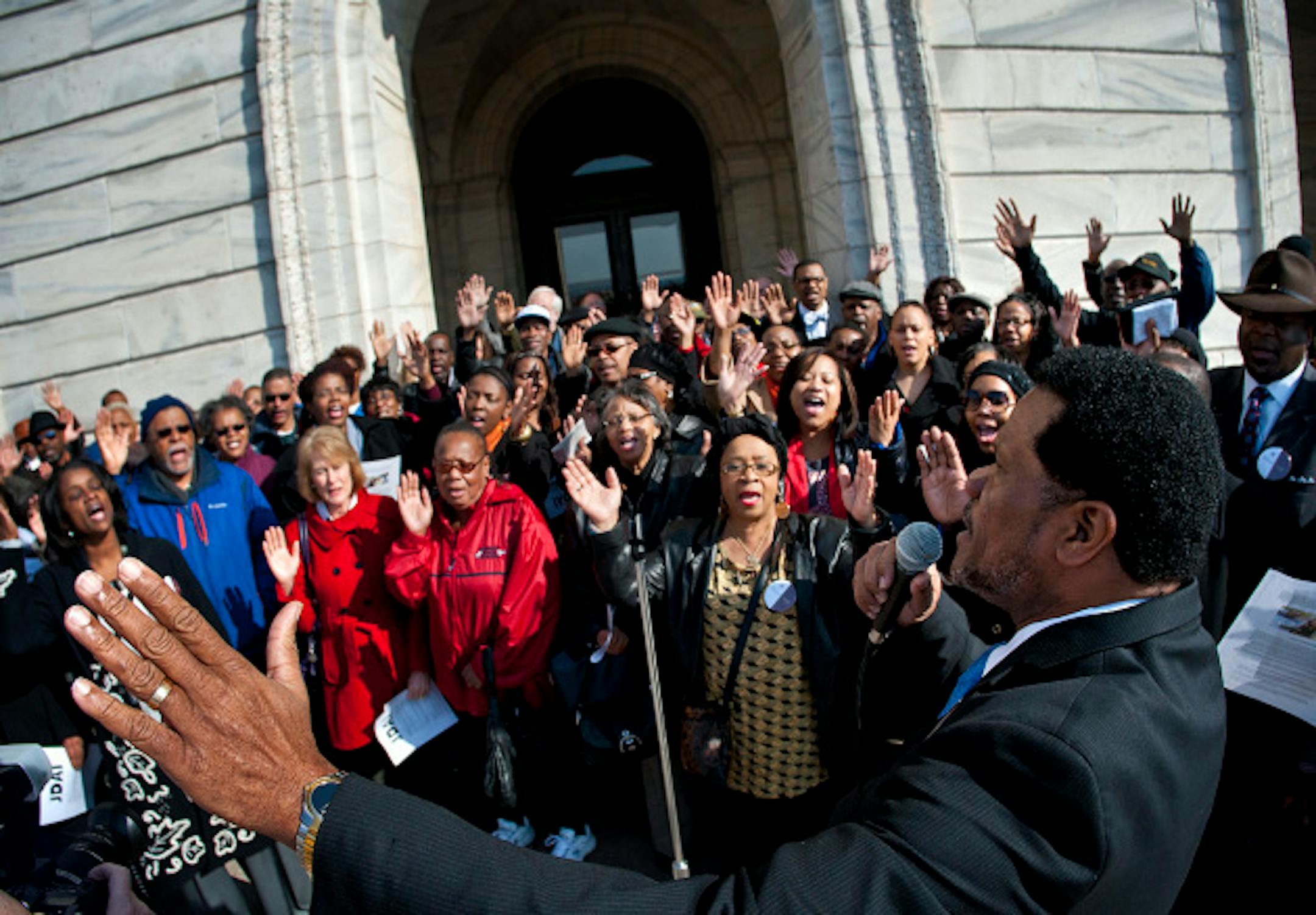 The group was told no singing was allowed in the Capitol so ISAIAH president Rev. Paul Slack led the group in a beautiful rendition of Amazing Grace and Oh Happy Day outdoors on the Capitol steps. African-American clergy and members of the faith community held a faith rally at the Minnesota State Capitol on the 45th anniversary of Dr. Martin Luther King's assassination to support a bill that would reduce racial disparities in juvenile detention and provide funding for alternatives.  Thursday, April 4, 2013  ]   GLEN STUBBE * gstubbe@startribune.com