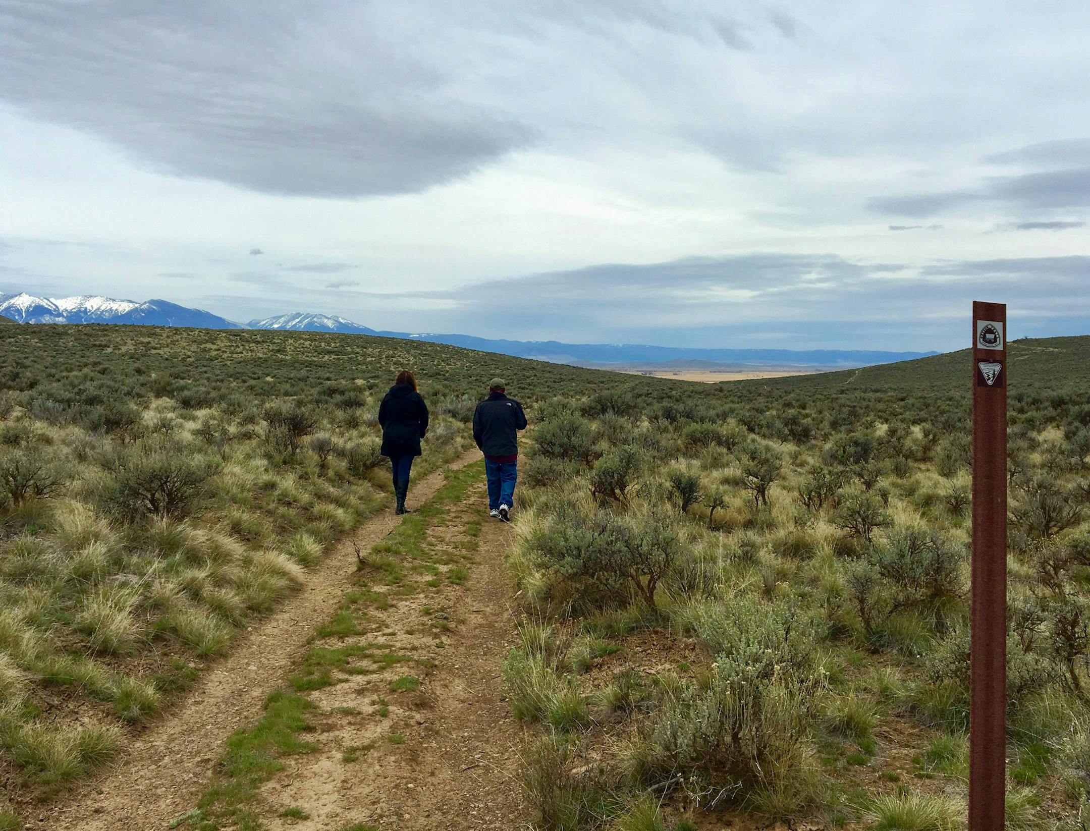 Visitors to the National Historic Oregon Trail Interpretive Center outside Baker City, Ore., walk in the ruts formed when hundreds of thousands of pioneers crossed this route headed to the towering Blue Mountains. (Terri Colby/Chicago Tribune/TNS) ORG XMIT: 1233400