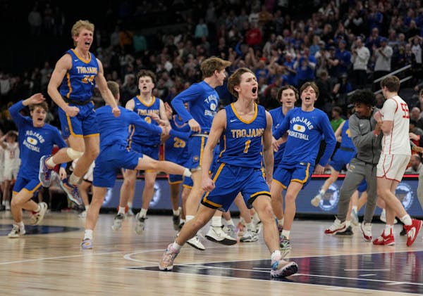 Wayzata players celebrate their last second win over Lakeville North. In front center is Wayzata guard Hayden Tibbits (1) who scored the game winning 