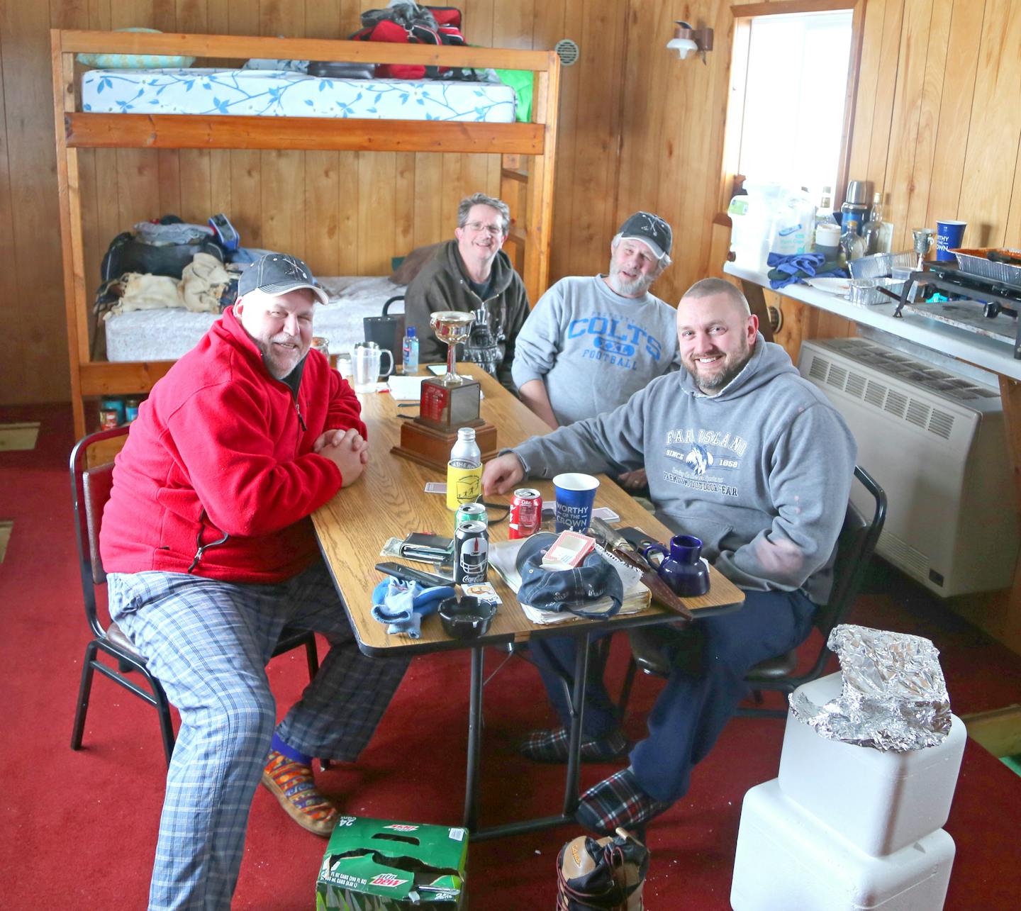 Fishing for fun: From left, Rick Atkins, 45; Ron Adkins, 61; Willy Adkins, 64, and Russ Adkins, 35, love Minnesota and fishing in the state in winter. Their annual cold-weather pilgrimages date back 42 years. Though they caught legal slot walleyes between 18 and 20 inches last week, each was released, as were many 2013-year-class fish measuring about 13.5 inches and some in the 28-inch class.