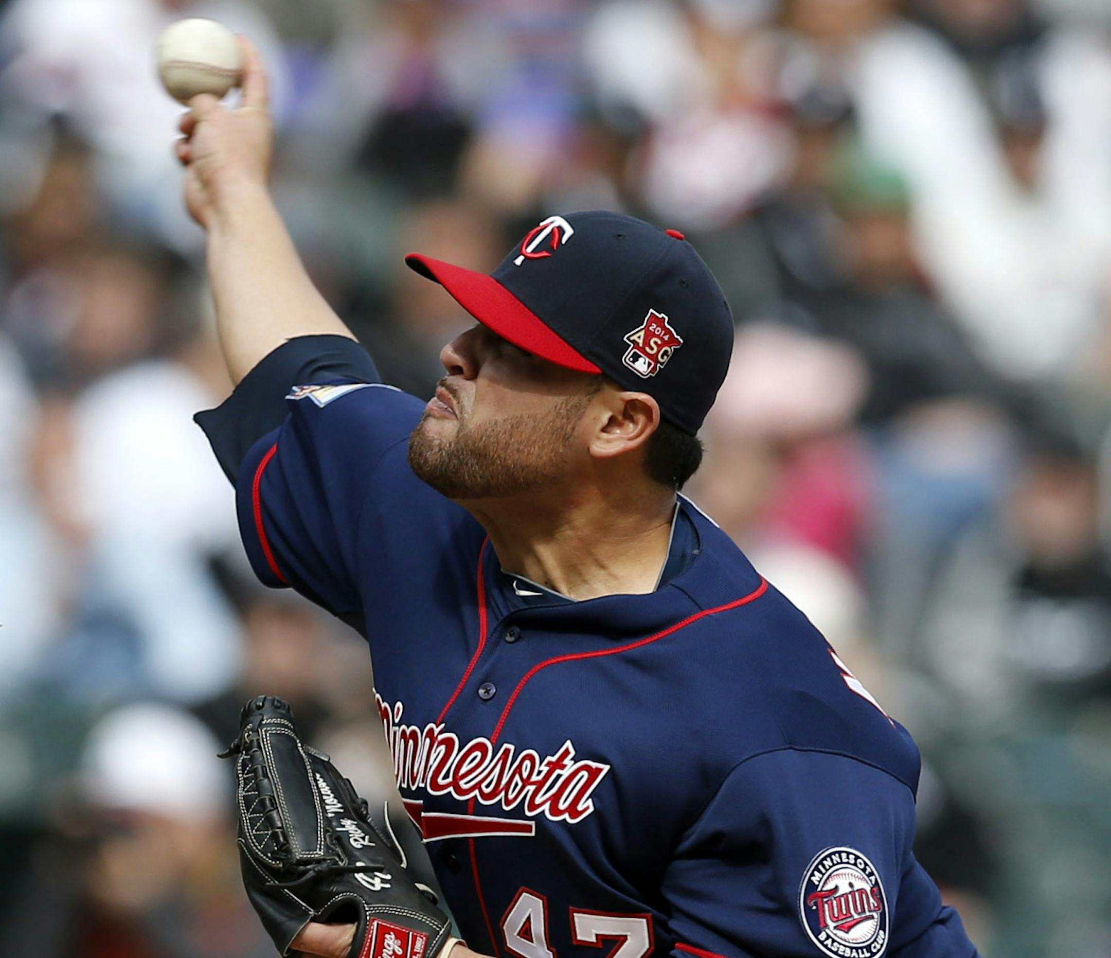 Minnesota Twins starting pitcher Ricky Nolasco delivers during the first inning of an Opening Day baseball game against the Chicago White Sox Monday, March 31, 2014, in Chicago. (AP Photo/Charles Rex Arbogast)