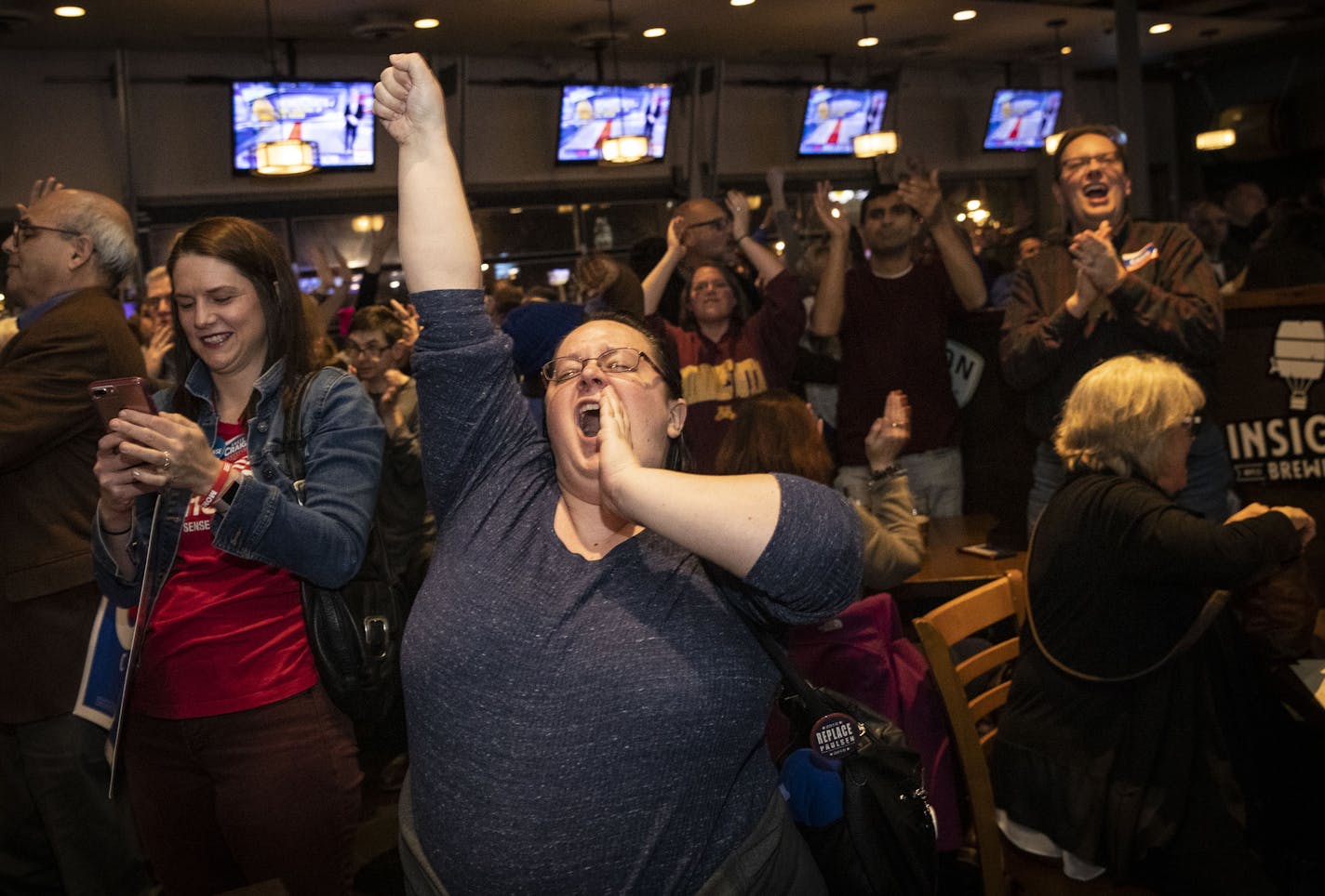 Angie Craig supporter Cantar&#xe9; Davunt cheered as election results came in on favor of Democratic candidates on Tuesday, November 6, 2018, at an election party for Craig at the Lone Oak Grill in Eagan, Minn. ] RENEE JONES SCHNEIDER &#x2022; renee.jones@startribune.com