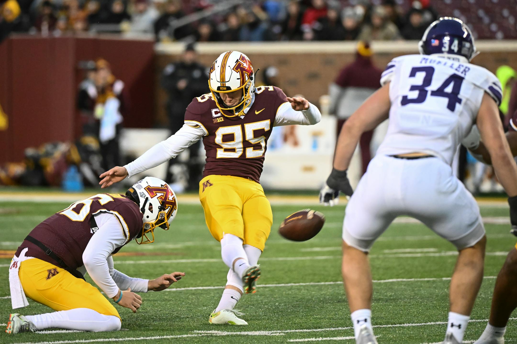 Minnesota Gophers place kicker Matthew Trickett (95) kicks a field goal against the Northwestern Wildcats during the second half.