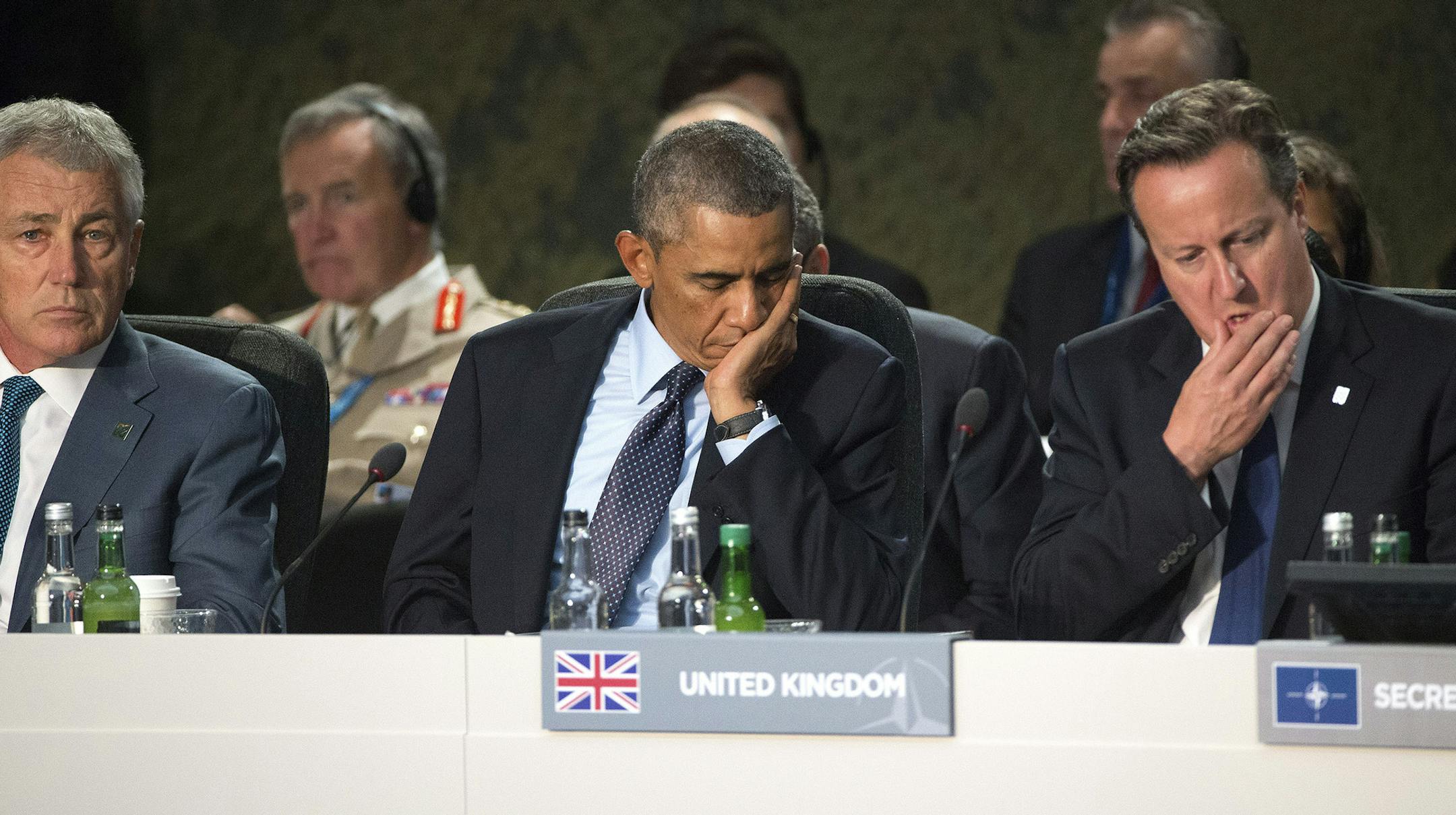 Defense Secretary Chuck Hagel, President Barack Obama and British Prime Minister David Cameron listen to NATO Secretary General Anders Fogh Rasmussen make an opening statement at a leaders meeting during the NATO summit in Newport, Wales, the United Kingdom, Sept. 5, 2014. In a hastily organized meeting on the sidelines of the summit, diplomats and defense officials from the U.S., Britain, France, Australia, Canada, Germany, Turkey, Italy, Poland and Denmark were said to have formed a coalition