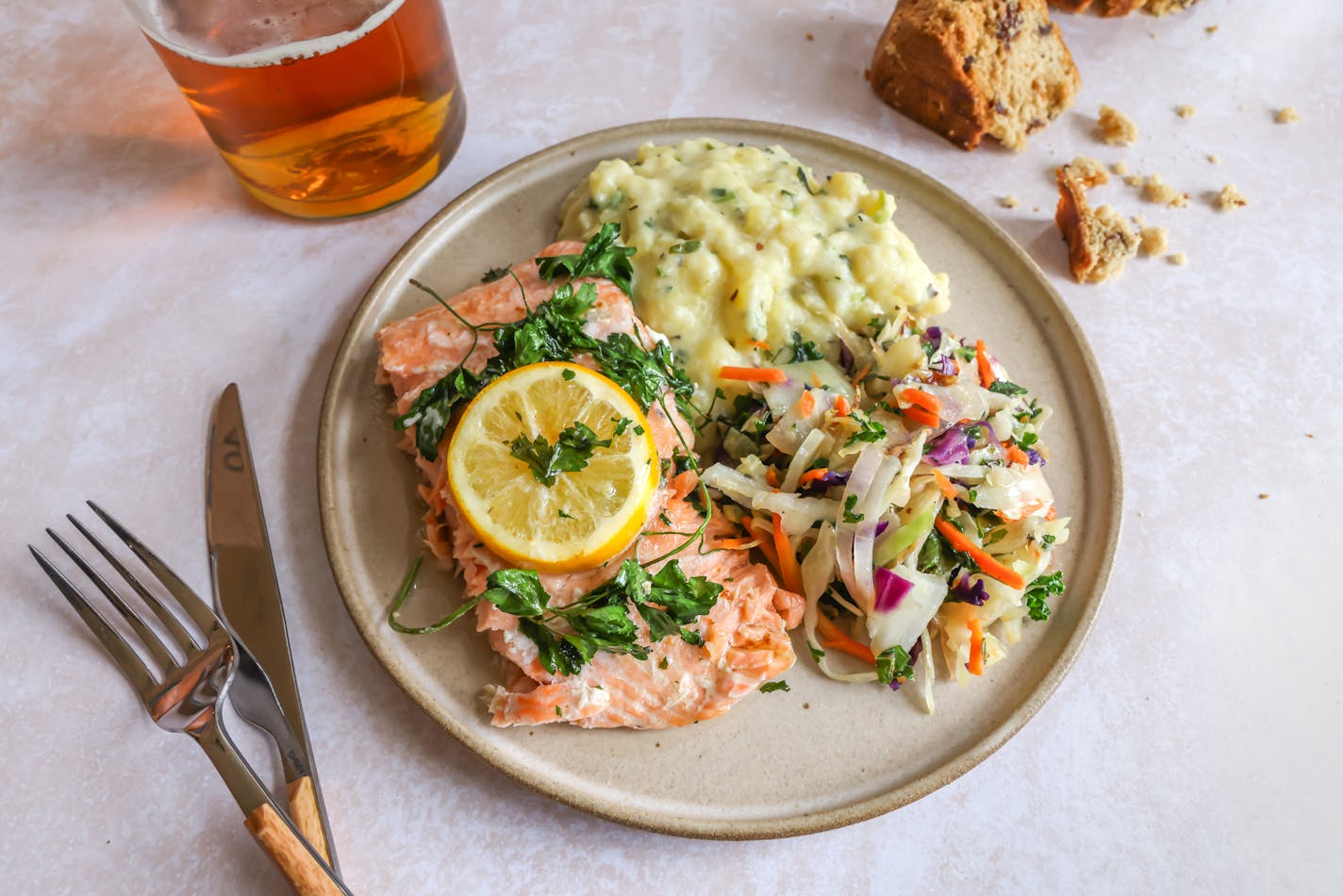 A traditional Irish meal for St. Patrick's Day: Salmon, Colcannon, mixed cabbage and carrots, and soda bread.