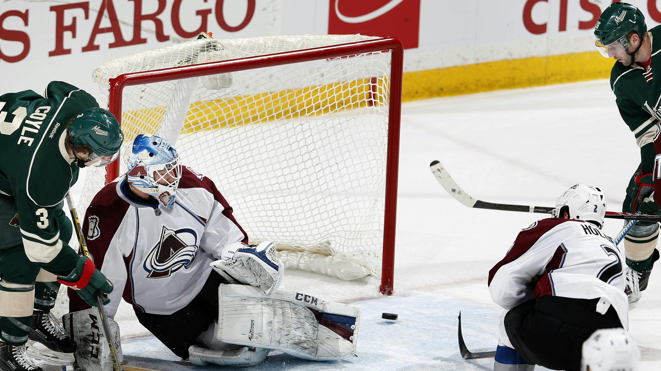 Charlie Coyle (3) passed the puck past Colorado goalie Reto Berra (20) to Thomas Vanek who scored a goal on the play in the third period. ] CARLOS GONZALEZ cgonzalez@startribune.com, March 8, 2015, St. Paul, Minn., Xcel Energy Center, NHL, Minnesota Wild vs. Colorado Avalanche