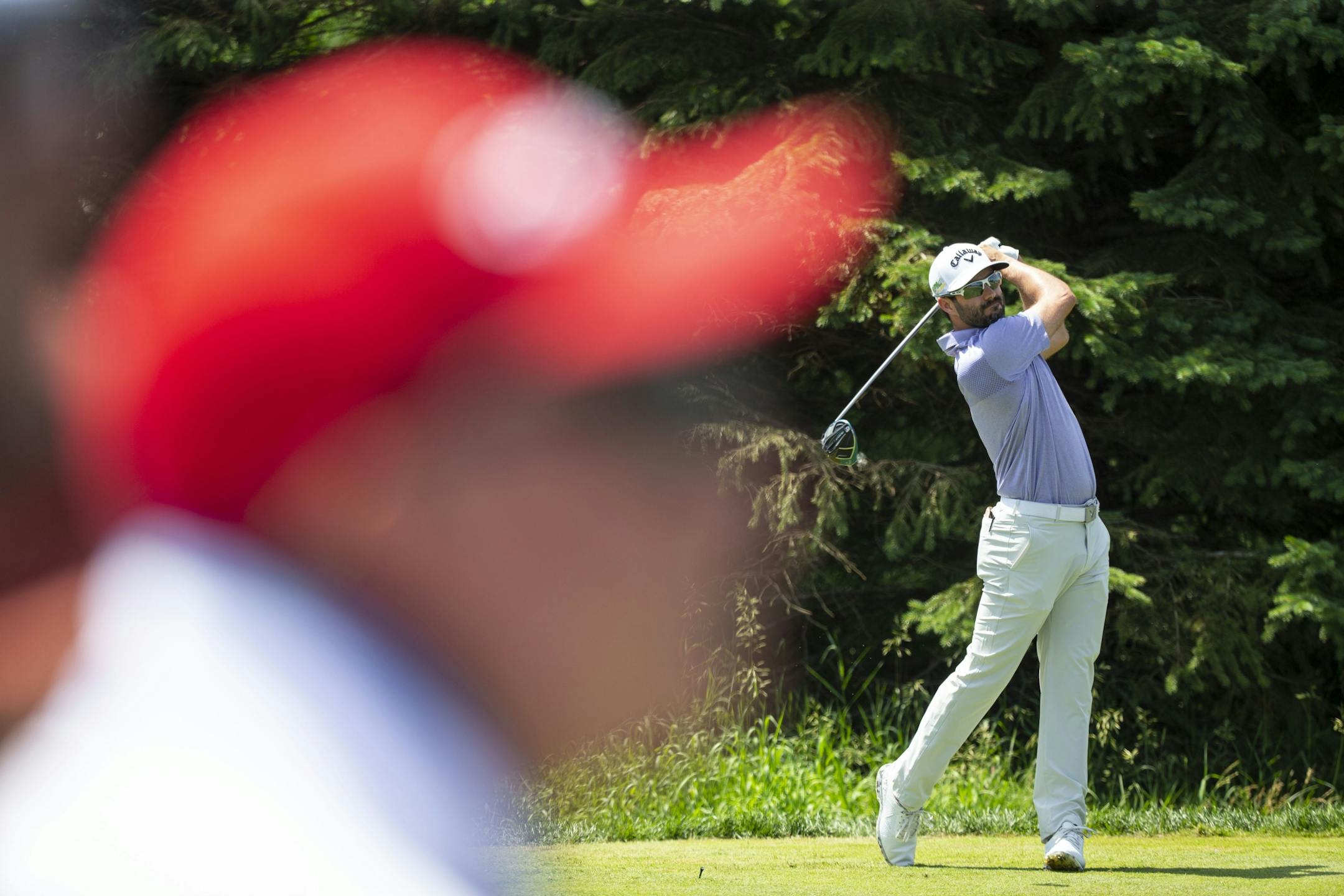 Adam Hadwin tees off on the second hole as spectators look on. ALEX KORMANN ¥ alex.kormann@startribune.com Competitors for the 3M Open took to the course on Saturday.