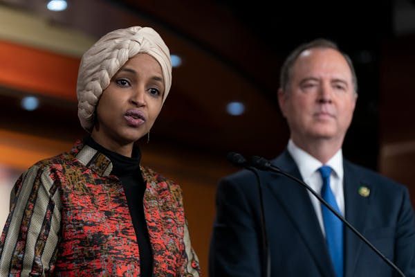 Rep. Ilhan Omar, D-Minn., with Rep. Adam Schiff, D-Calif., right, spoke during a news conference on Capitol Hill in Washington on Wednesday.