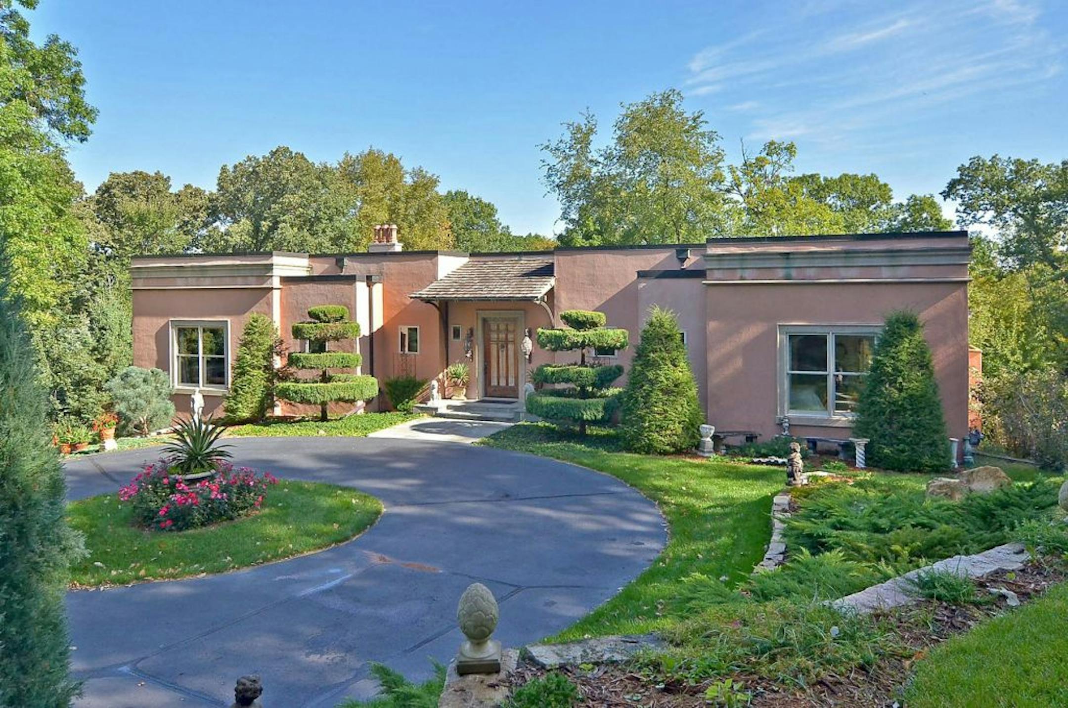 Front view of the circular drive in front of Tuscan-style house in Bloomington.
