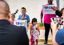 Council Member Dai Thao watched his son, 7-year-old Justice, deliver a speech on June 15 on the importance of the SPARK initiative in St. Paul.