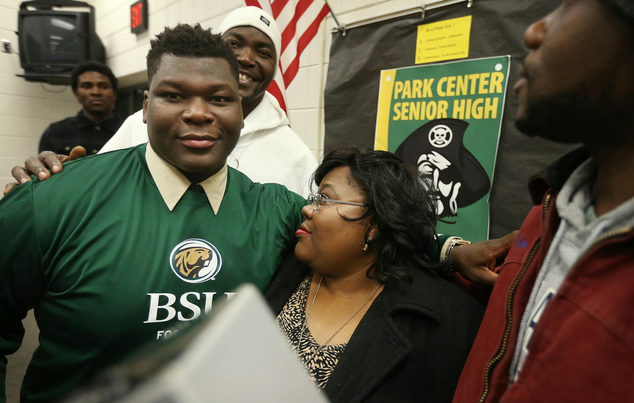 Josh Wleh hugged his mom Vesta Wleh after he signed his letter to play football at Bemidji State University Wednesday Feb 03, 2016 in Brooklyn Park, MN. ] National signing day a Park Center High School. Jerry Holt/Jerry.Holt@Startribune.com