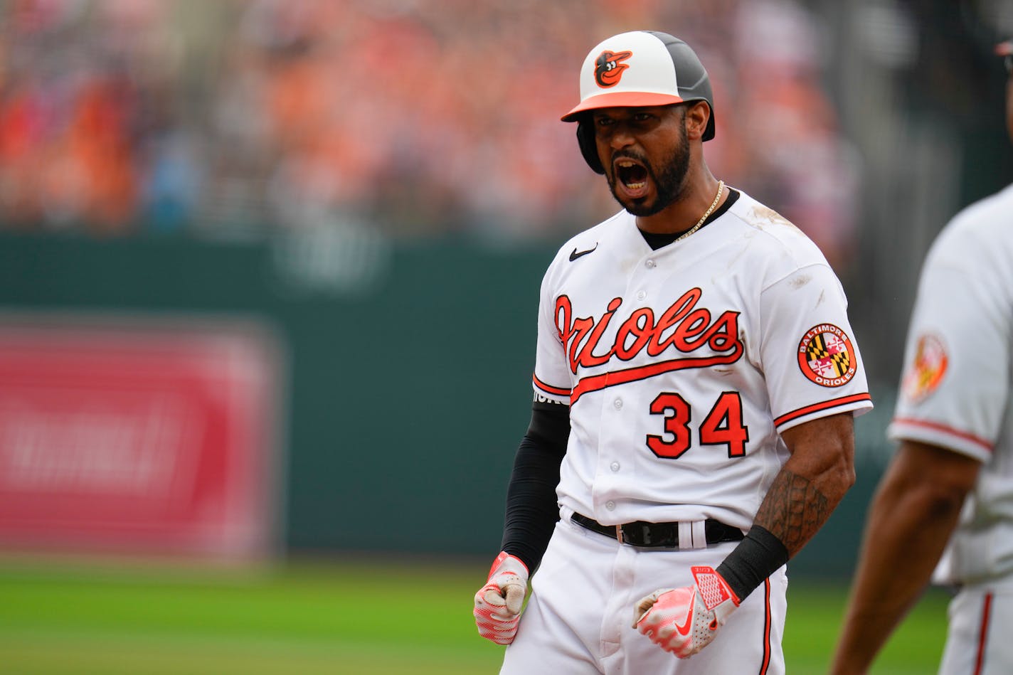 Baltimore Orioles' Aaron Hicks reacts after hitting an RBI single to score Adley Rutschman against the Minnesota Twins in the eighth inning of a baseball game, Sunday, July 2, 2023, in Baltimore. The Orioles won 2-1. (AP Photo/Julio Cortez)