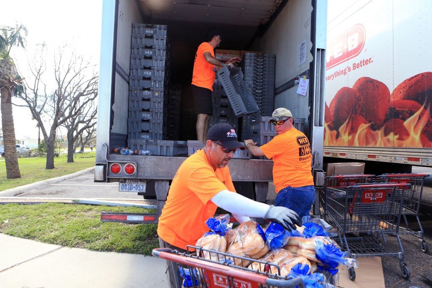 H-E-B employees helped distribute water, ice and bread to Aransas Pass residents on Tuesday, Aug. 29, 2017, in Rockport, Texas. Many want to help victims of Hurricane Harvey, but charity watchdogs warn those who want to help to research before donating through web sites.