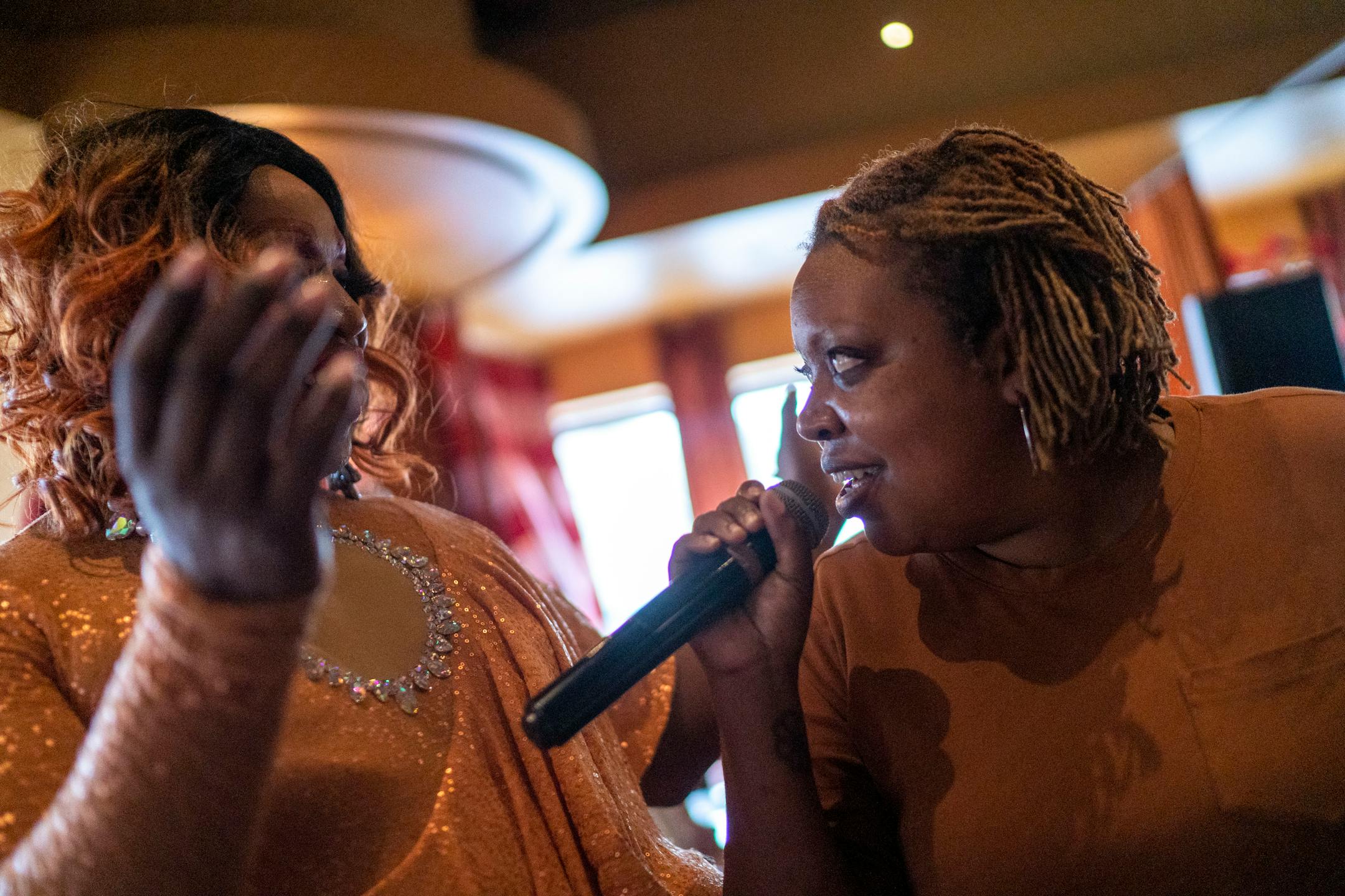 Nyanyika Banda, right, sings along to "Proud Mary" by Tina Turner during a drag brunch performance at Crave on Sunday, June 20, 2021, in Minneapolis. ] ANTRANIK TAVITIAN • anto.tavitian@startribune.com