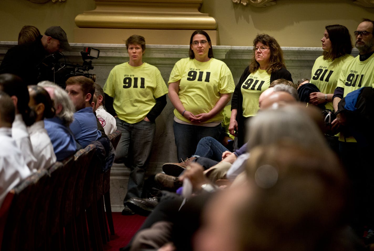 Michelle Swenson, Kari Pflaum and Wendy Forster stood frustrated with fellow 911 dispatch colleagues during a presentation about Minneapolis 911's cross training initiative in Minneapolis, Minn., on Wednesday, March 19, 2014. The employees felt they were being misrepresented and didn't agree with some of the statements made. (RENEE JONES SCHNEIDER &#x2022; reneejones@startribune.com)