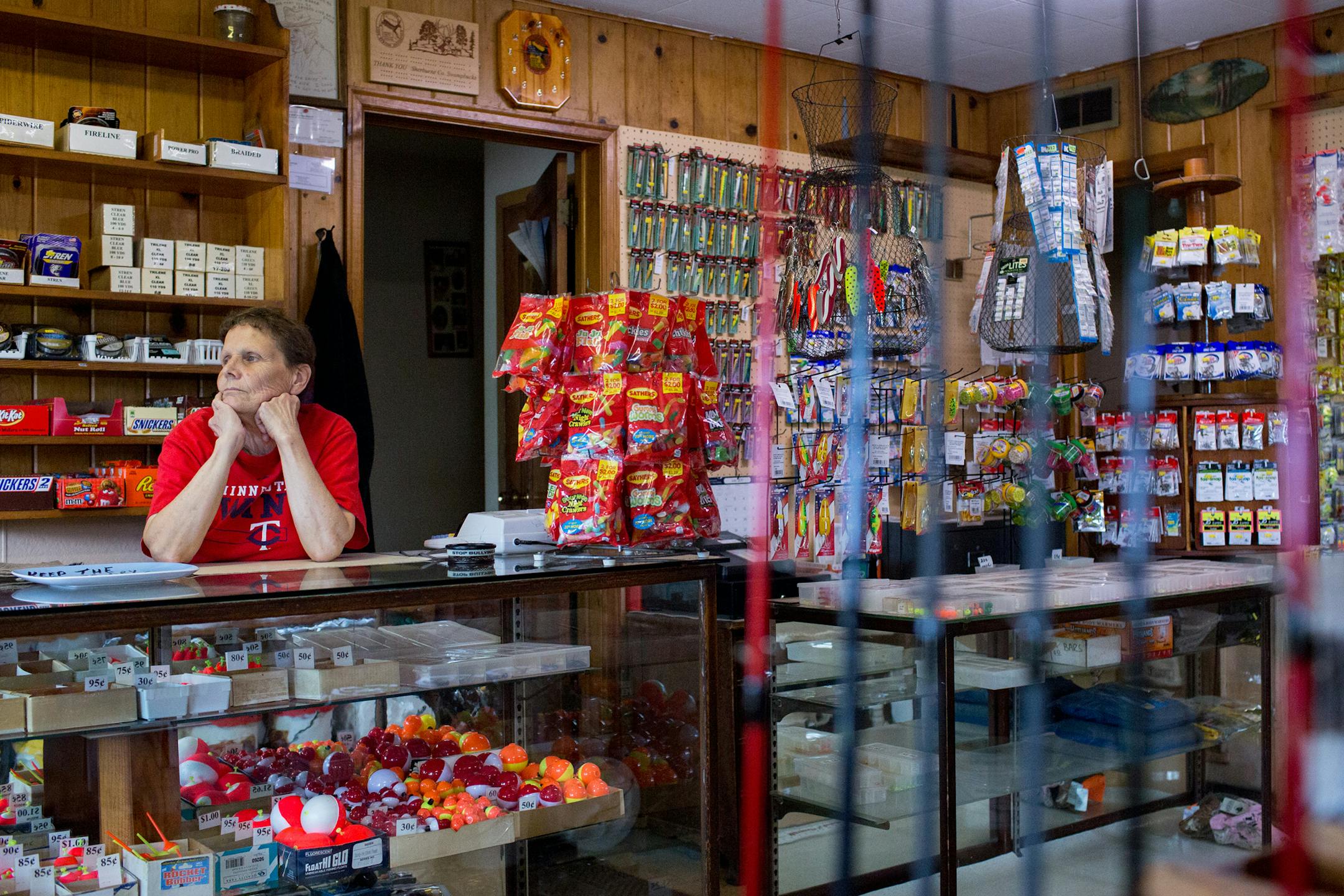 Joanne Rousseau looks out the window and waits for customers at Ebner's Live Bait in Elk River. Rousseau has worked at the shop since 1979 but bought the shop from her parents in 1993. ] COURTNEY PEDROZA ¥ courtney.pedroza@startribune.com Joanne Rousseau owner of Ebner's Live Bait in Elk River; July 21, 2017. Rousseau has worked at the shop since 1979 but bought the shop from her parents in 1993.