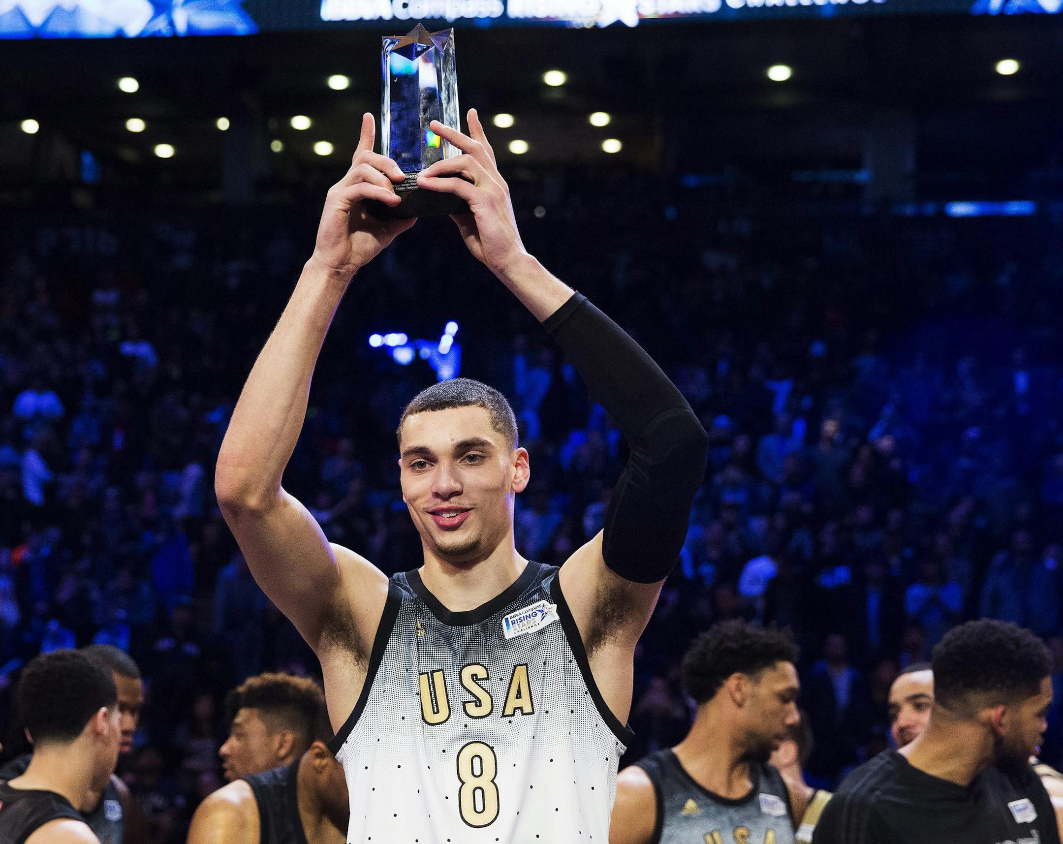 United States player Zach LaVine holds the MVP trophy after the NBA Rising Stars Challenge basketball game in Toronto, Friday, Feb. 12, 2016. (Mark Blinch/The Canadian Press via AP) MANDATORY CREDIT