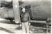 Lowell Swenson is shown with a bomber during World War II.