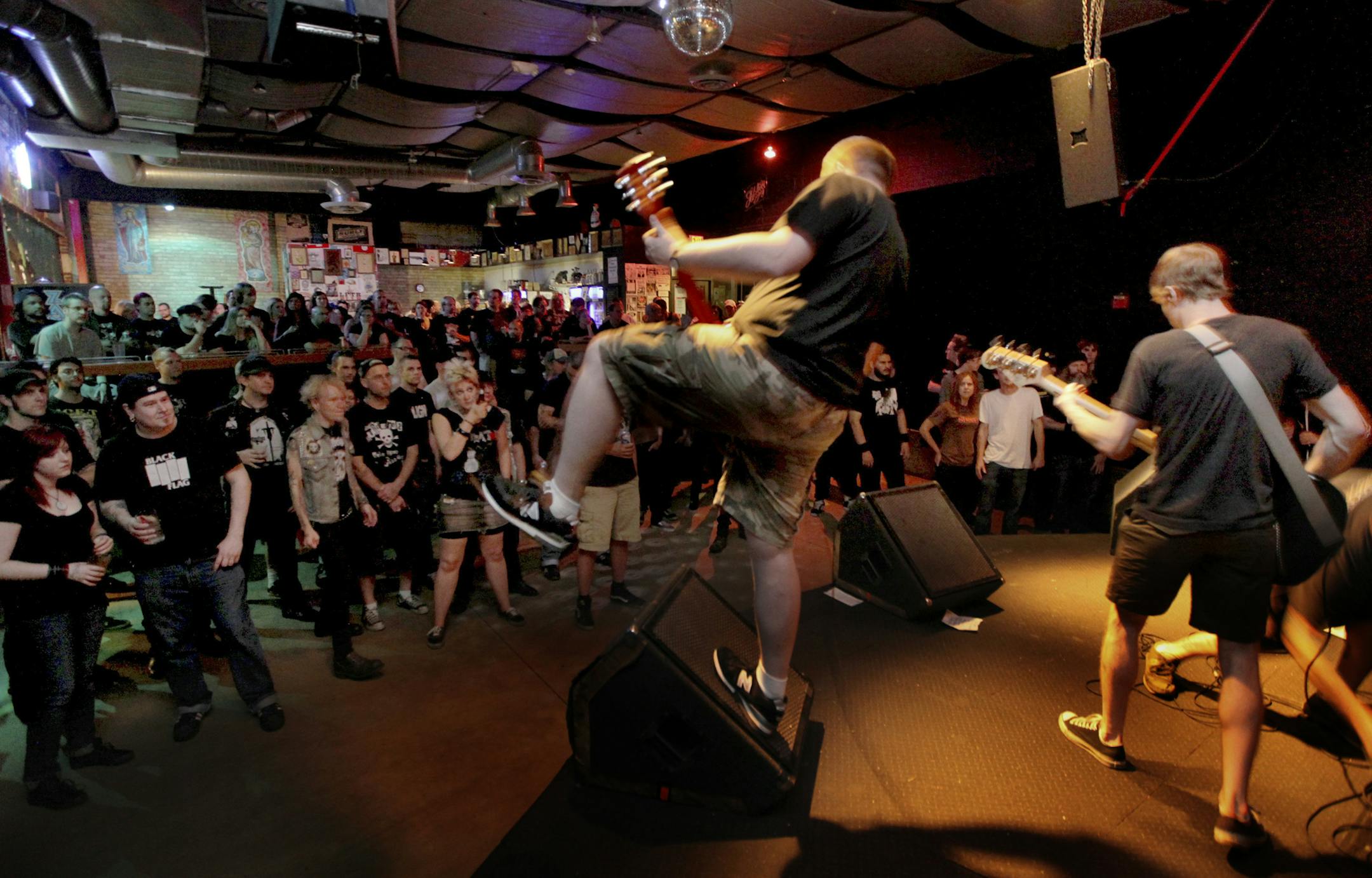 Triple Rock is a punk rock club (with a bar), Pete Ayers, Guitar And the rest of Getting Even band, Jayson Aronen, vocals, Nate Rastetter, Bass and Phil Schwarz, guitar, not in photo is Steve Smillie, drums, open the show at the Triple Rock. [ TOM WALLACE &#x2022; twallace@startribune.com Assign #20009445A Slug: night0911 Date: Sept 8, 2009 ORG XMIT: MIN2017070321002848