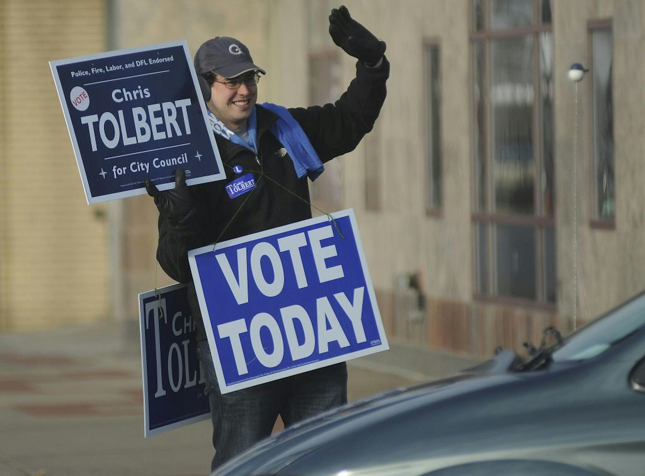 Matt Freeman of St Paul, Minn. held a sign on Ford Parkway in support of Chris Tolbert for City Council on Tuesday morning November 8, 2011 in St Paul, Minn