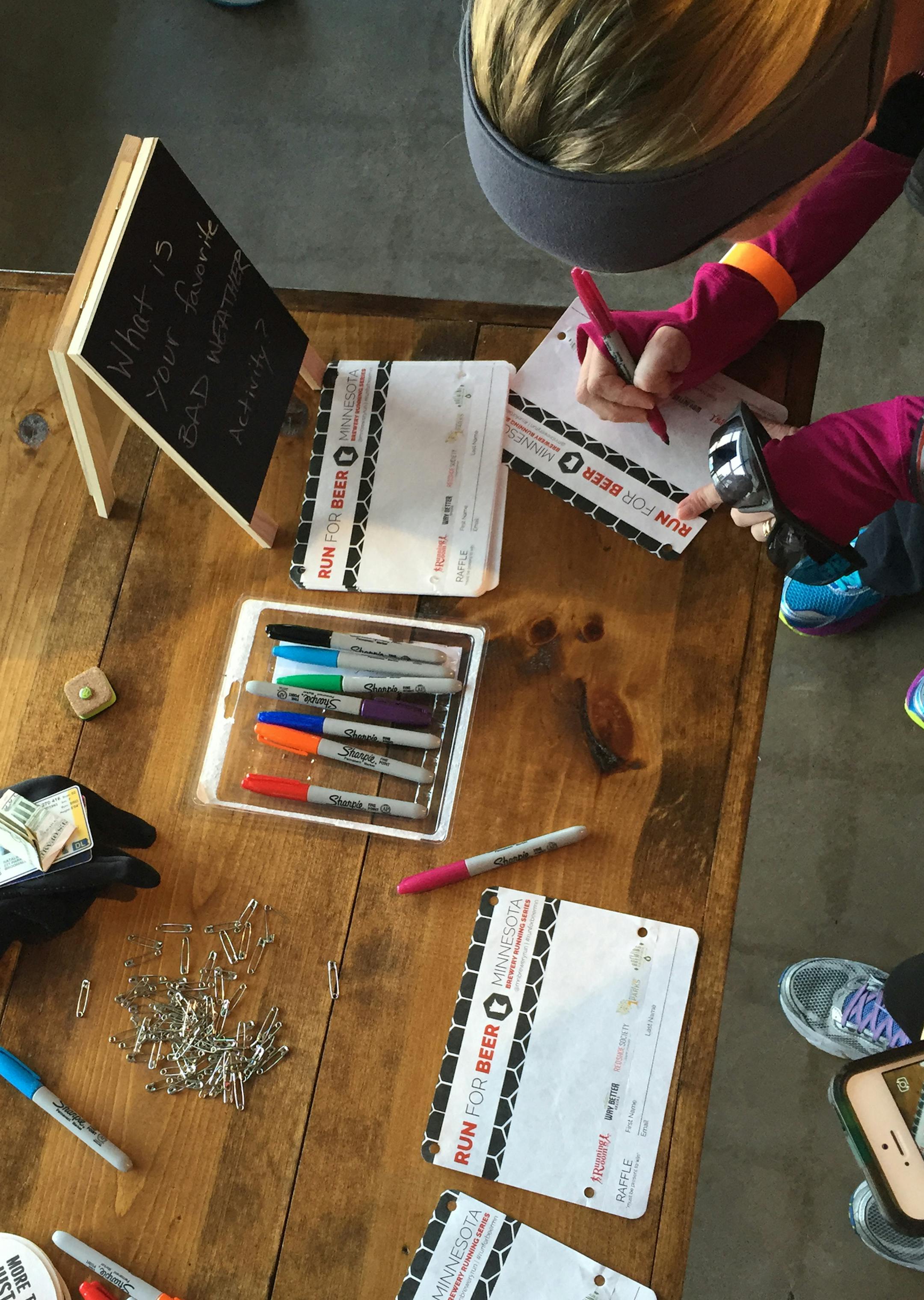 Participants wrote their answers to the question &#x201c;What&#x2019;s your favorite bad weather activity?&#x201d; on their race bibs, which don&#x2019;t have timing trackers or numbers.