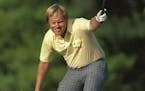 April 13, 1986 file photo: Jack Nicklaus watches his putt drop for a birdie on the 17th hole at Augusta National