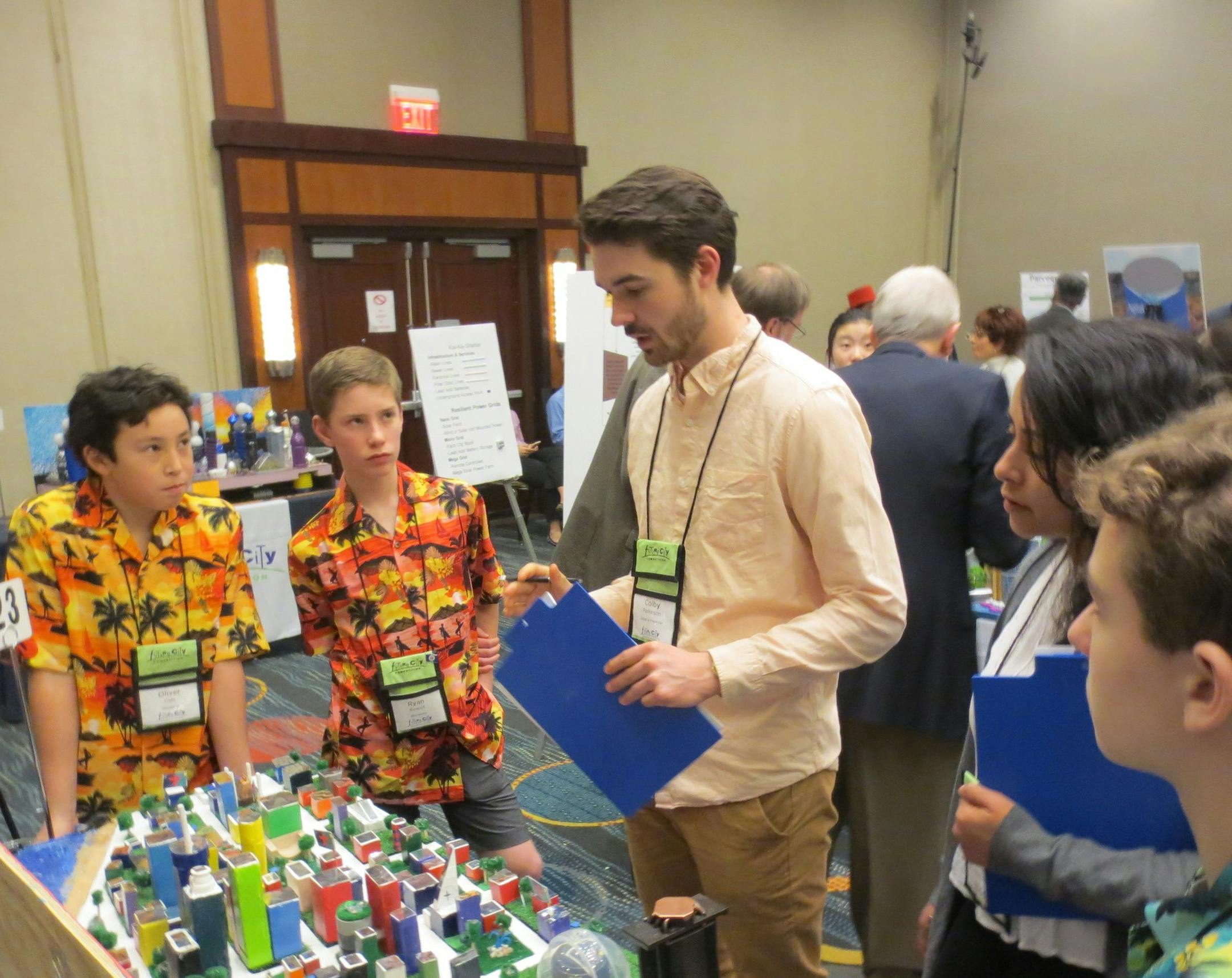 Justice Page students Oliver Gels, left, and Ryan Rowell presented their Maui cityscape to judges in Washington, D.C.