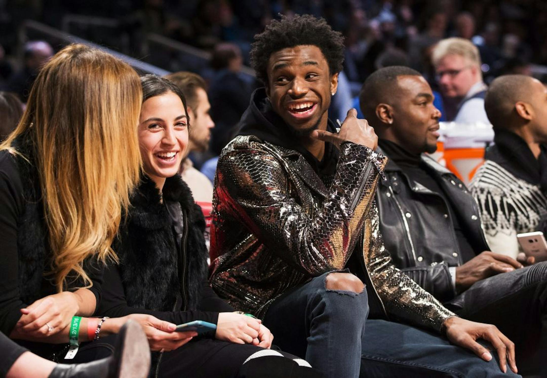 Minnesota Timberwolves Andrew Wiggins, center, laughs during the NBA all-star skills competition in Toronto on Saturday, Feb. 13, 2016. (Mark Blinch/The Canadian Press via AP) MANDATORY CREDIT