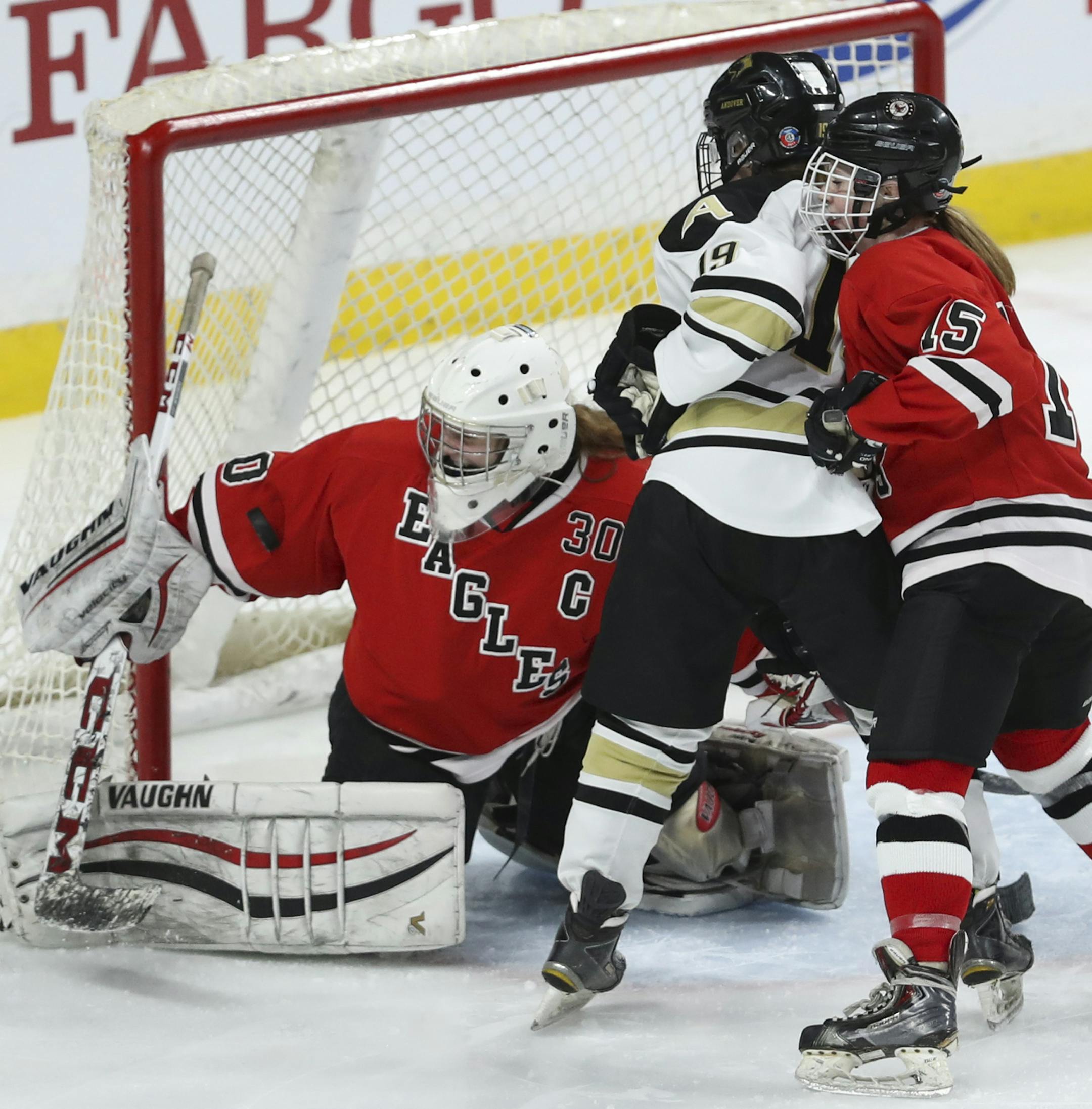 Eden Prairie goalie Alexa Dobchuk stopped an Anodover shot with her right arm while Andover's Claire Butorac awaited a rebound in the third period. The Eagles' Claire Kuipers defended. ] JEFF WHEELER ï jeff.wheeler@startribune.com Eden Prairie beat Andover 2-0 in a Class 2A quarterfinal game in the Girls' Hockey Tournament Thursday night, February 22, 2018 at Xcel Energy Center in St. Paul.