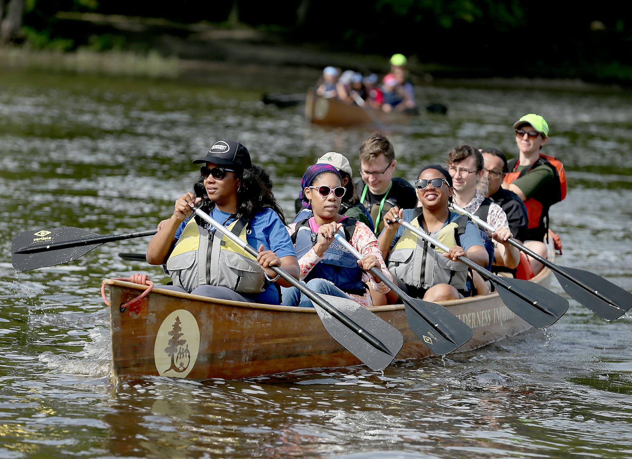 Rue Mapp, left, the Founder of Outdoor Afro, led a canoe of members behind the Secretary of the Interior Sally Jewell as the paddled along the Mississippi to celebrate the 100th anniversary of the National Parks Service. ] (ELIZABETH FLORES/STAR TRIBUNE) ELIZABETH FLORES • eflores@startribune.com