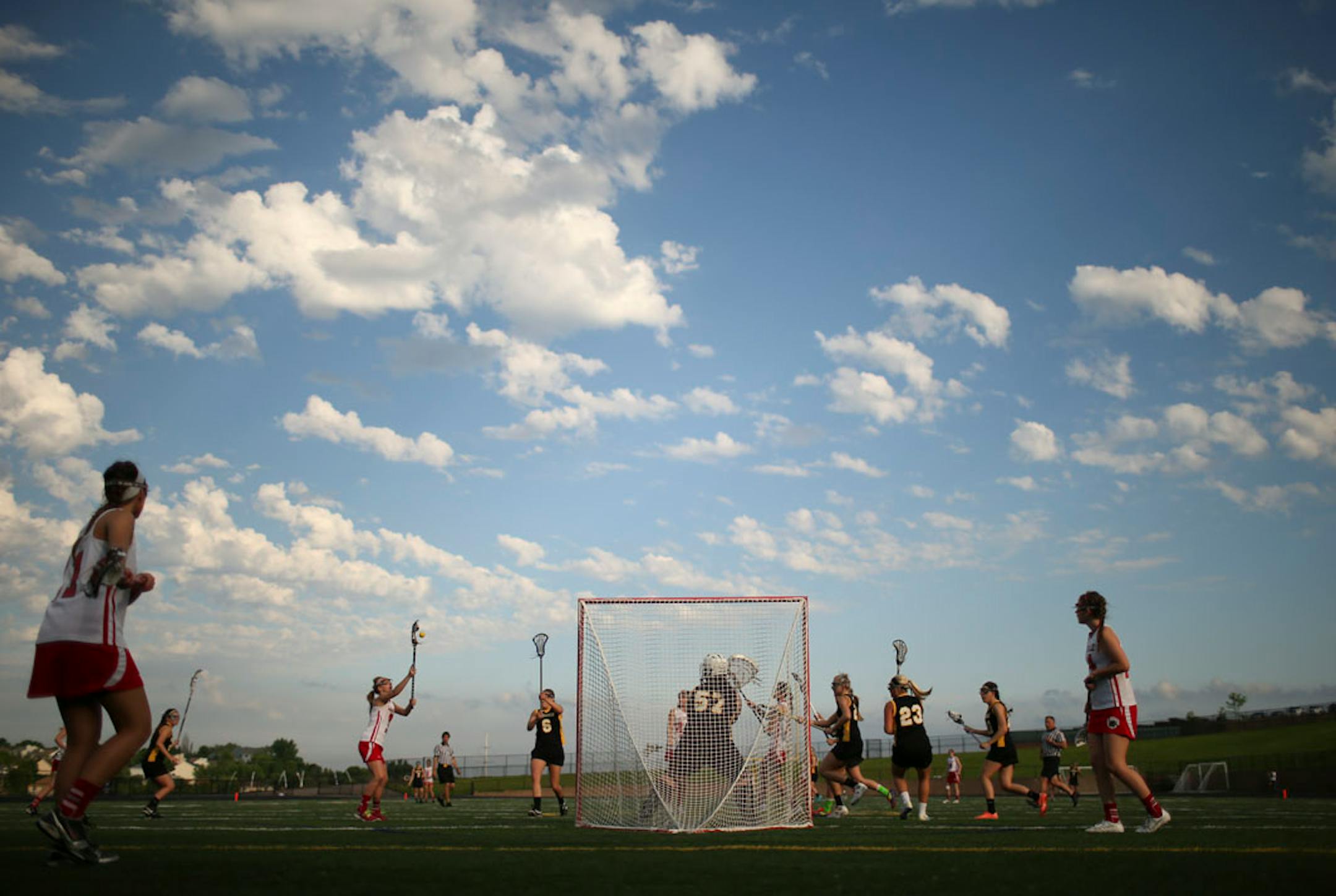 Lakeville North and Burnsville met in a Girls' Lacrosse State Tournament quarterfinal game at Chanhassen High School Tuesday night, June 11, 2013. Lakeville North's Hannah Tillou reached for a pass in the first half in front fo the Burnsville goal.