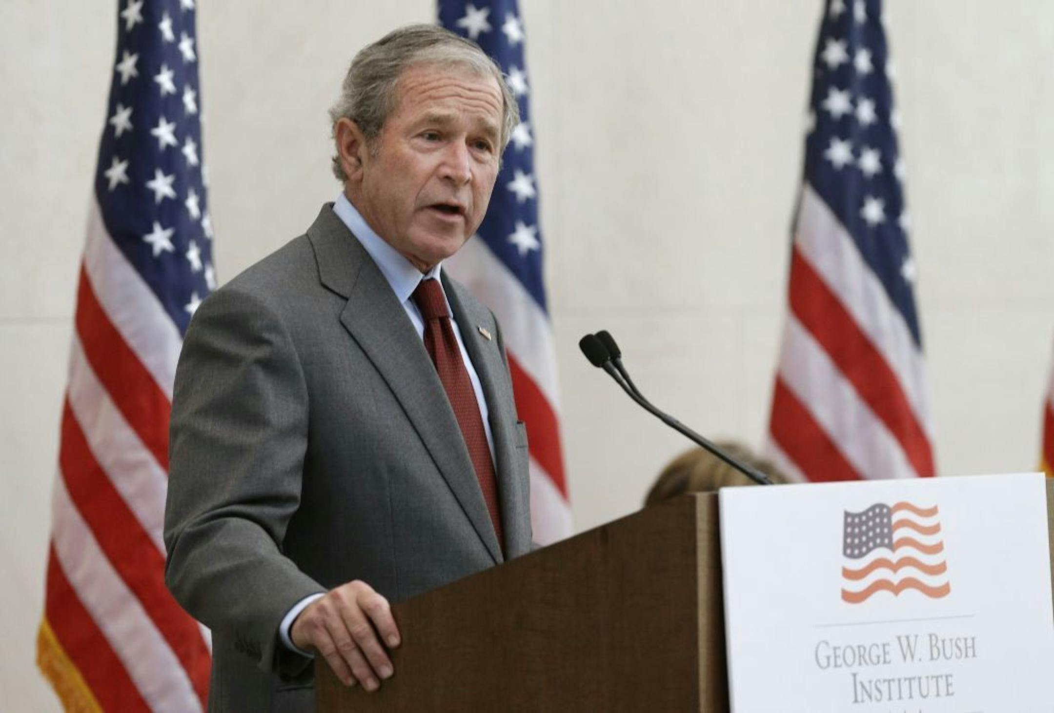 Former President George W. Bush gives a speech before a U.S. citizen swearing in ceremony at the The George W. Bush Presidential Center in Dallas, Wednesday, July 10, 2013. Twenty new citizens took the oath of U.S. citizenship at the former president's library.