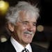FILE - In this Jan. 25, 2012 file photo, Dennis Farina arrives at the premiere for the HBO television series "Luck" in Los Angeles.