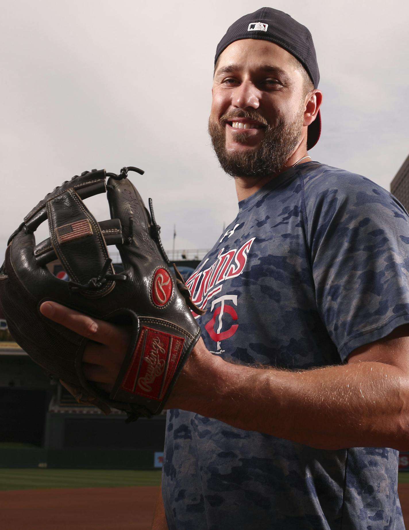 Minnesota Twins third baseman Trevor Plouffe with his glove Thursday afternoon, before infield and batting practice at Target Field. JEFF WHEELER &#xef; jeff.wheeler@startribune.com Twins infielder Trevor Plouffe, photographed with his glove Thursday afternoon, July 9, 2015 at Target Field in Minneapolis.