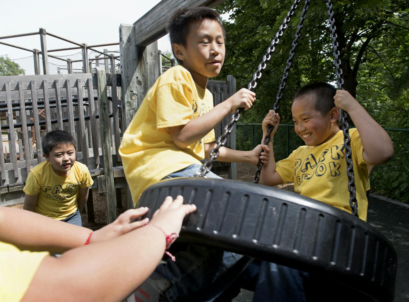 Park Brook 3rd graders Drake Thammavongsa, left, and Aaron Vu enjoy the tire swing during a recess trip to French Regional Park on Wednesday. ] isaac.hale@startribune.com A push to desegregate major regional Twin Cities parks and trails has created a rise in diversity among children at parks. During the afternoon of Wednesday, June 8, 2016, 3rd-grade students from Park Brook Elementary took to the French Regional Park in Plymouth, MN, for recess.