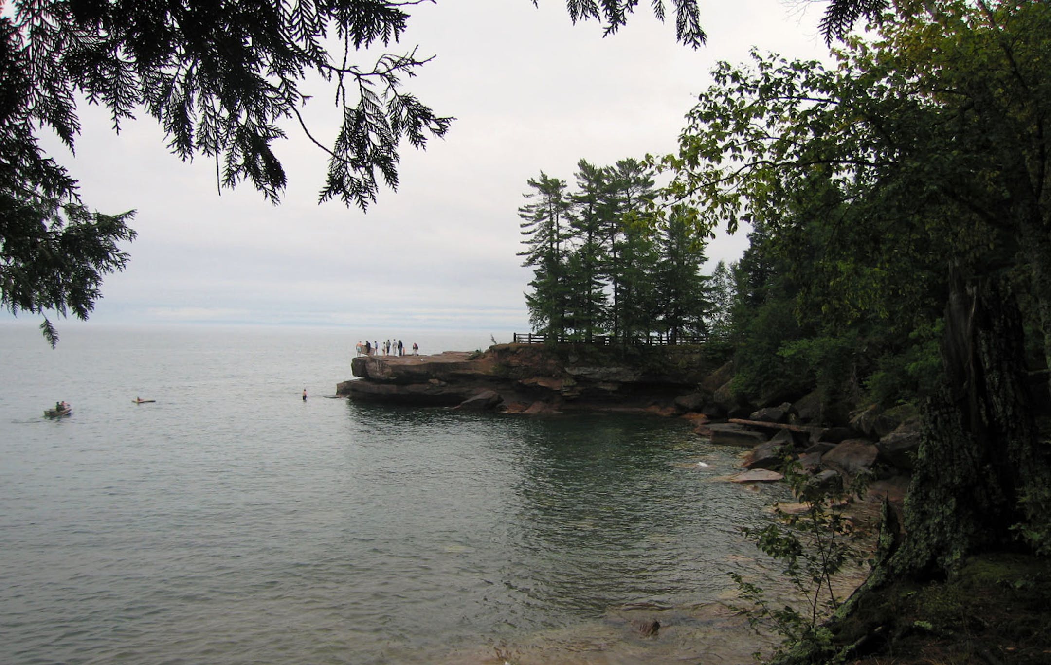 Family frolics on rocks at Big Bay State Park.