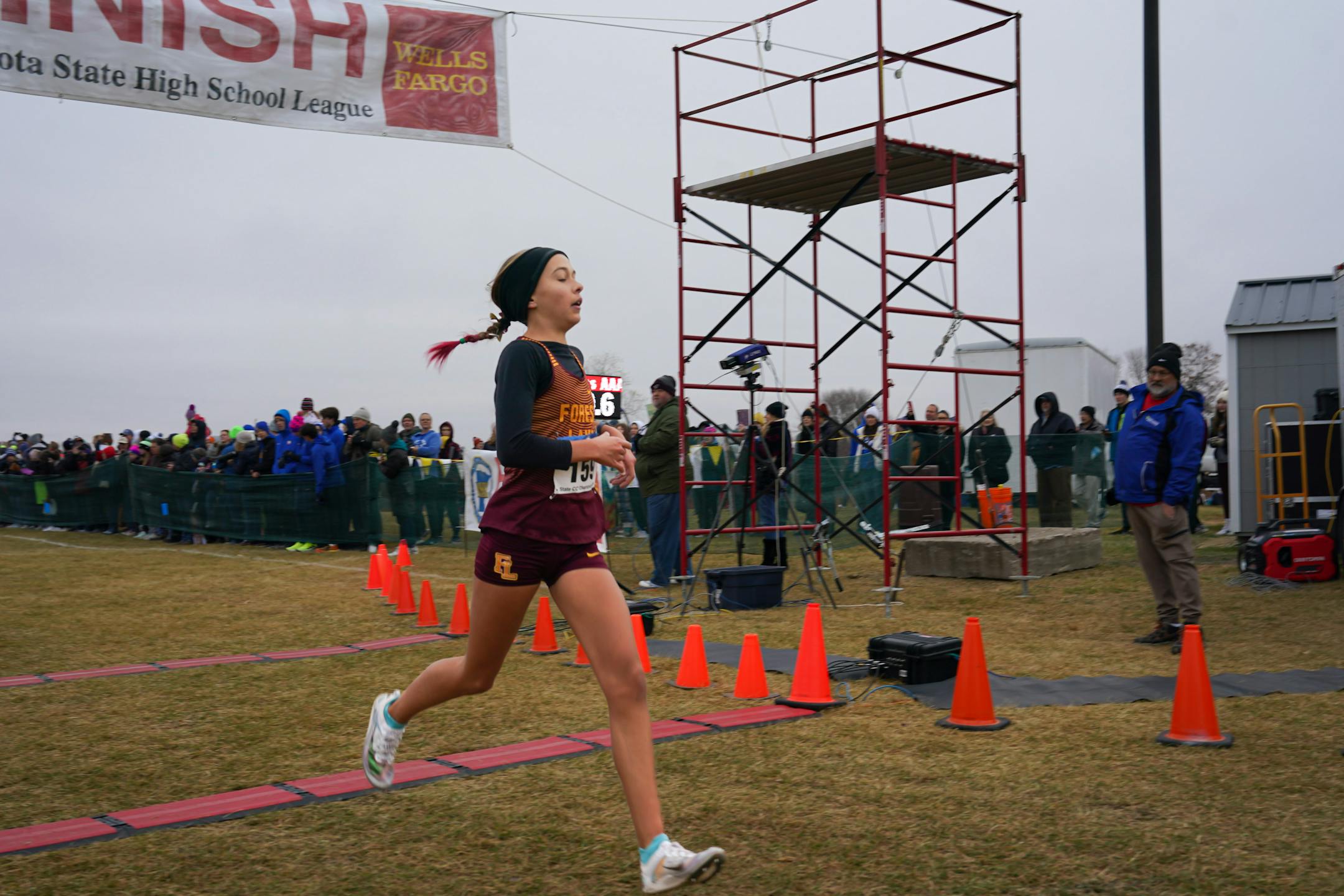 Norah Hushagen of Forest Lake crosses the finish line, coming in third with a time of 17:48.53.