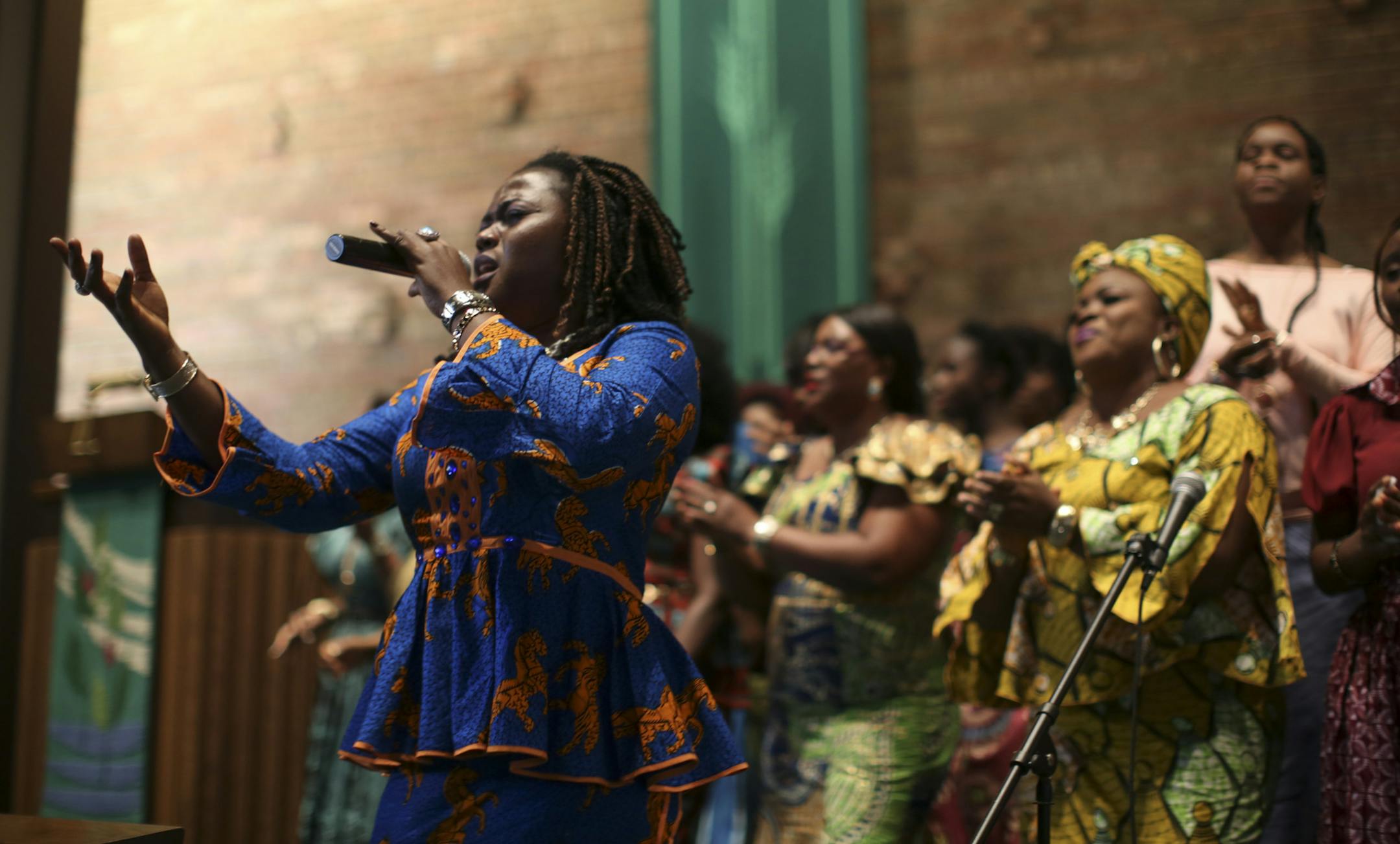 Comfort Koon and the Community Worship Team sang at a service Sunday afternoon at Cross of Glory Lutheran Church in Brooklyn Center, where Minnesota Liberians and others honored Thomas Eric Duncan and shared fellowship.