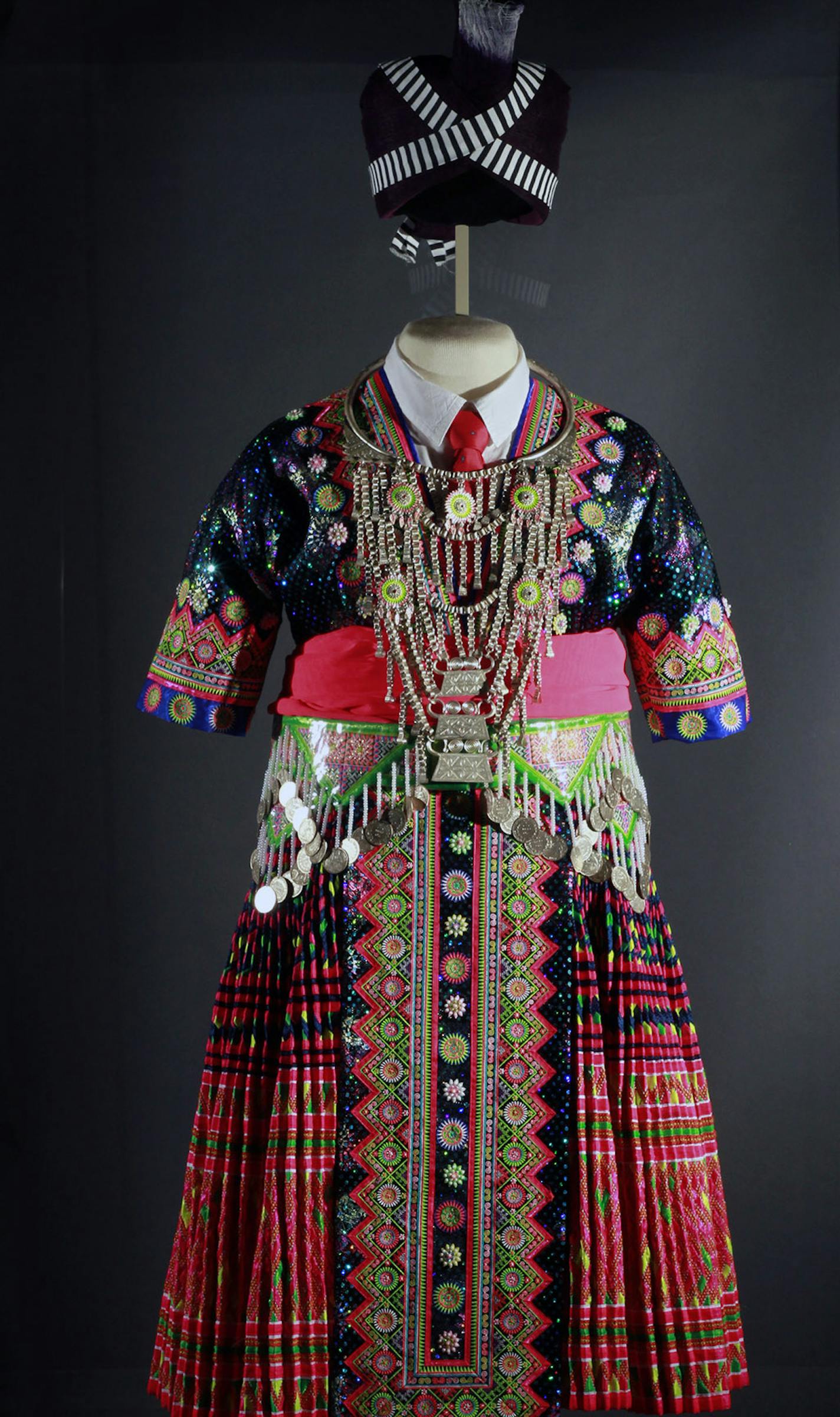 Hmong in Minnesota exhibit at the Minnesota History Center - artifact - a traditional ceremonial dress -Traditional Green Hmong woman's outfit, courtesy Center for Hmong Studies, Concordia University, St. Paul