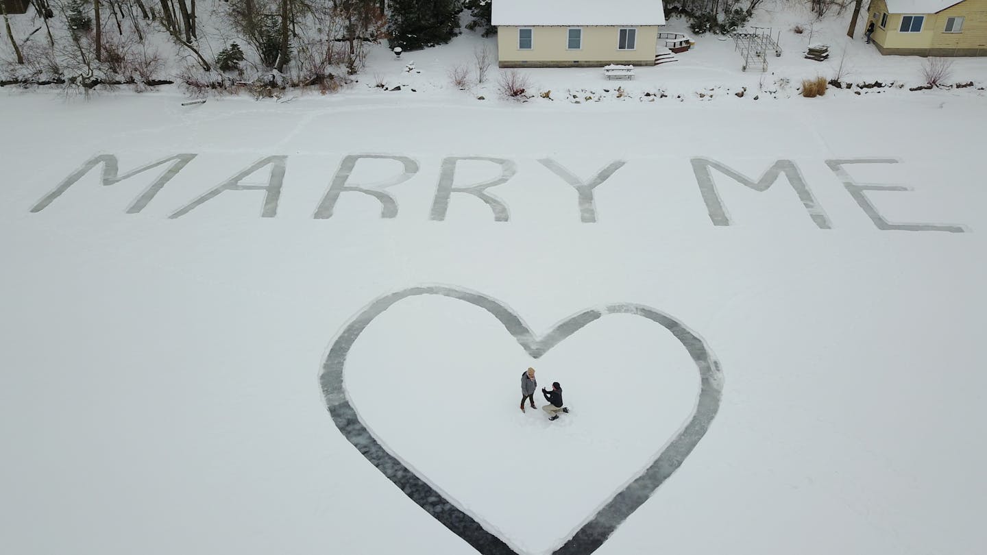 A snow proposal over Eighth Crow Wing Lake near Nevis, Minn.