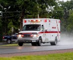 Police escort an ambulance from an area where law enforcement officers were searching for David Sweat, one of two convicted murderers who broke out of
