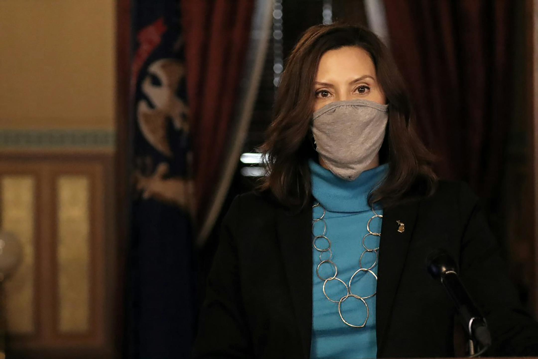 In a photo provided by the Michigan Office of the Governor, Gov. Gretchen Whitmer addresses the state during a speech in Lansing, Mich., Thursday, Nov. 12, 2020. Hospital leaders warned Thursday that more than 3,000 people are hospitalized with the coronavirus in Michigan, a rate that is doubling every two weeks and is expected to top the spring peak of about 4,000 by late this month.