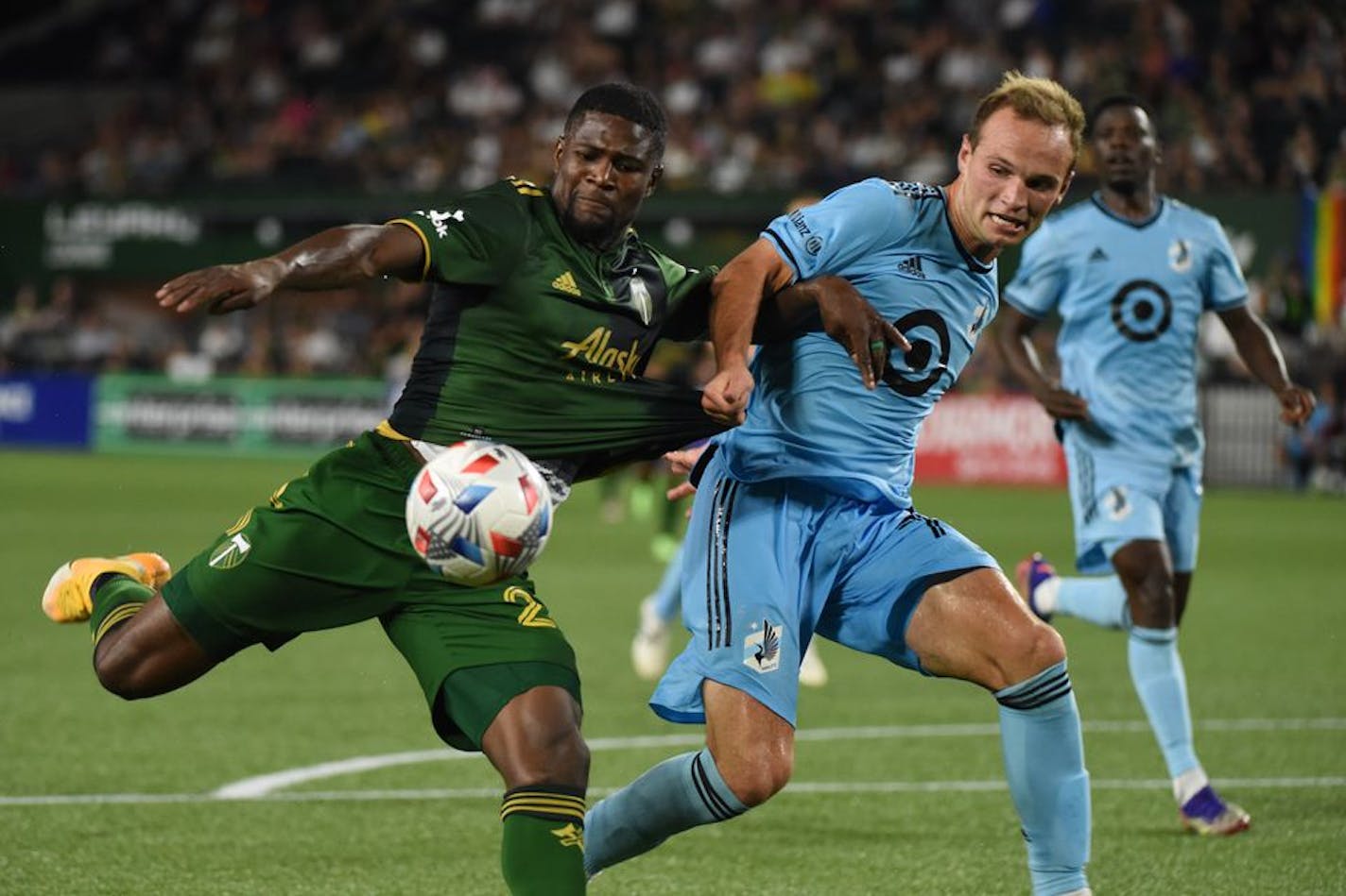 Minnesota United's Chase Gaspar, right, battled for the ball with Portland's Dairon Asprilla during the second half Saturday, June 26, 2021 at Providence Park in Portland, Ore. (Photo by Rockne Andrew Roll for The Oregonian) ORG XMIT: 20098397P