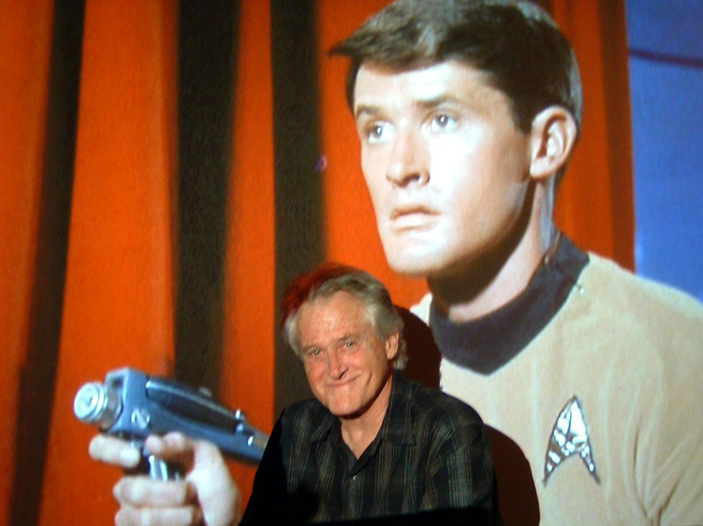 St. Cloud actor Bruce Hyde posed next to a projection of his appearance on the classic 1960s "Star Trek" TV series to mark the release of the episode on DVD in 2004.