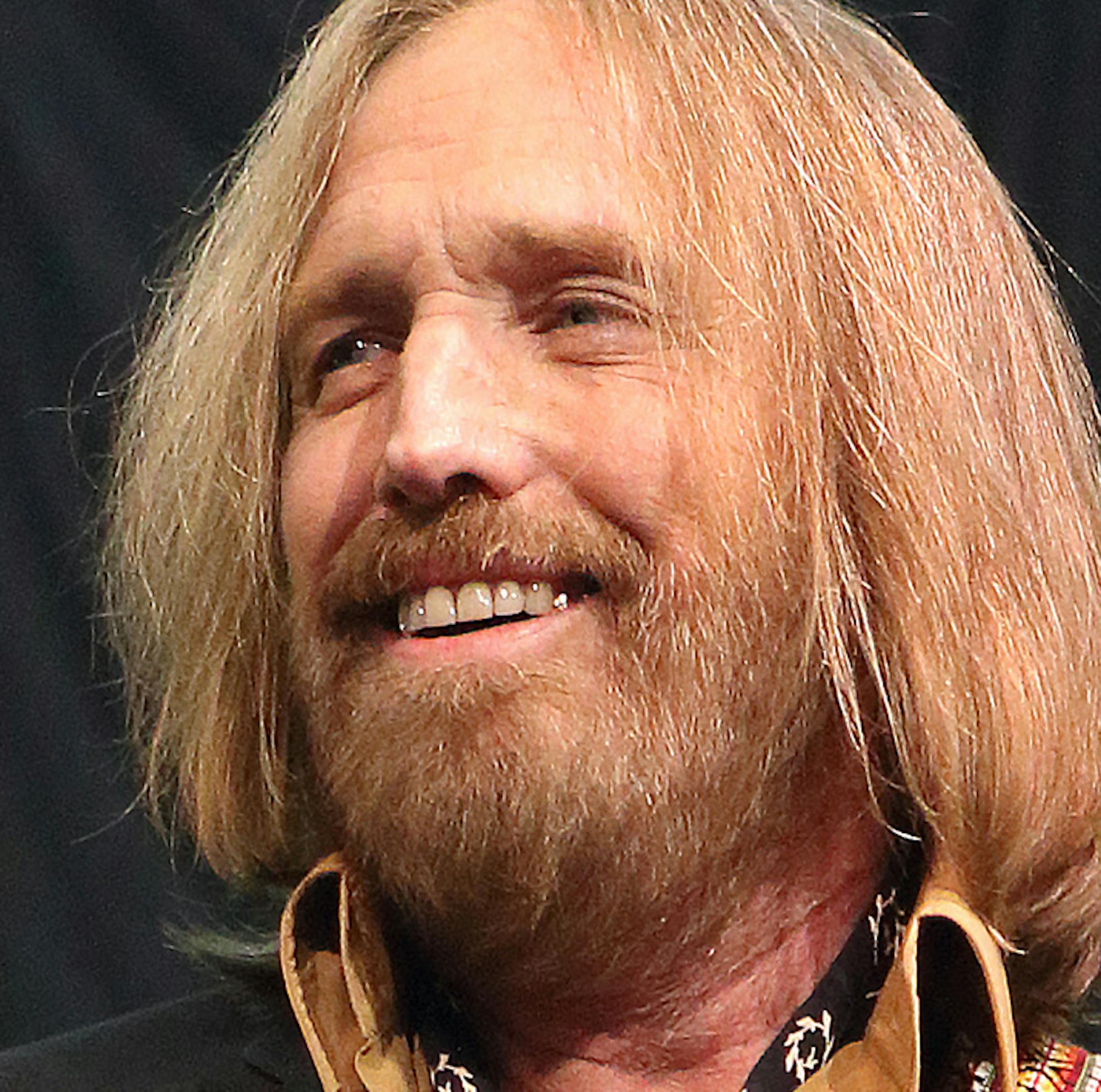 FILE - In this Sept. 15, 2014 file photo, Tom Petty performs in concert with Tom Petty and the Heartbreakers during their ëHypnotic Eye Tour 2014î in Philadelphia. Petty says he has no hard feelings toward singer Sam Smith and called the similarities between Smith's Grammy-nominated hit "Stay With Me" and Petty's 1989 song "I Won't Back Down" a musical accident. he Rock and Roll Hall of Famer said in a statement posted to his website Tuesday that "all my years of songwriting have shown
