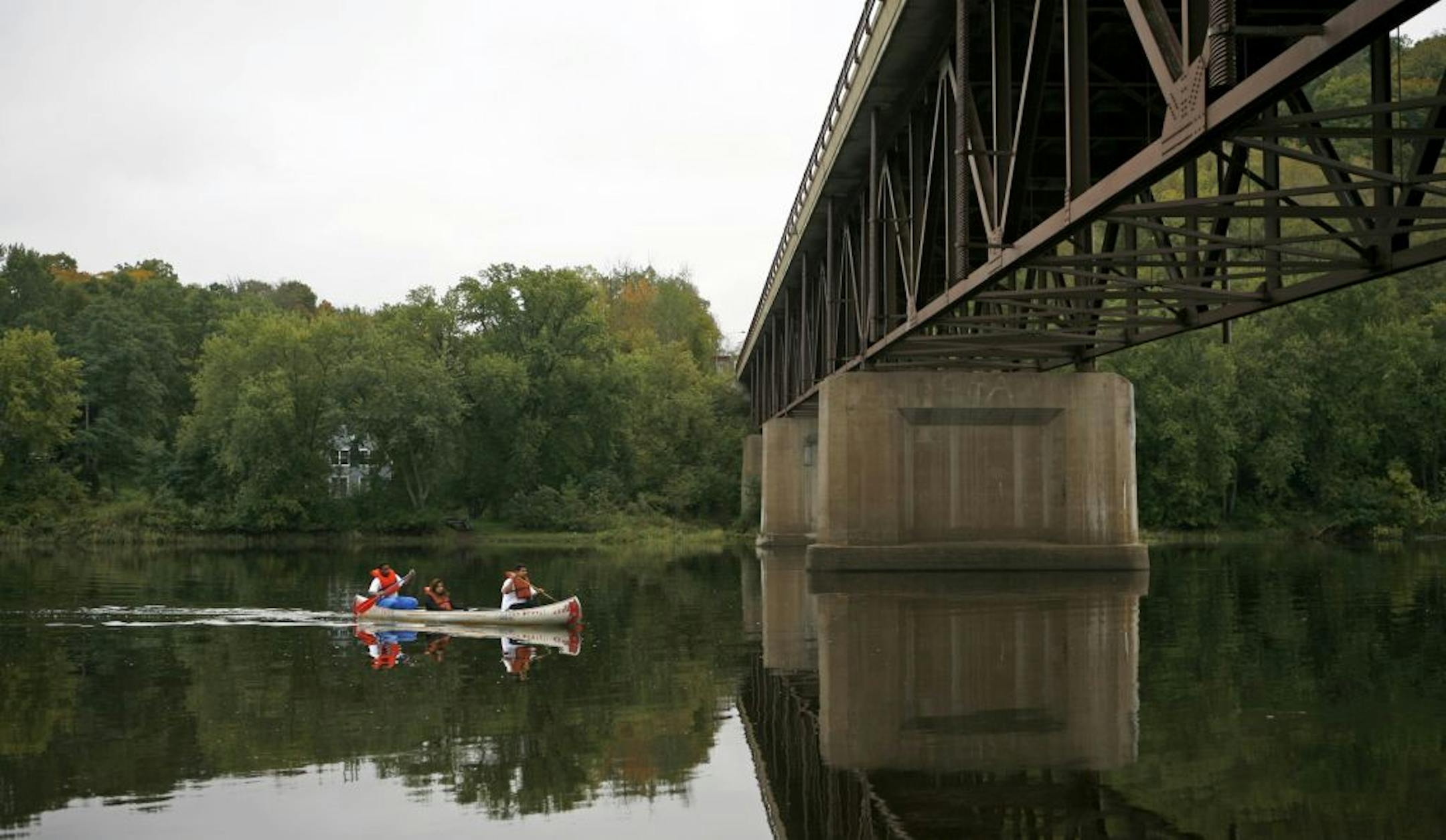 Happy paddlers glide along a quiet stretch of the St. Croix River south of Taylors Falls.