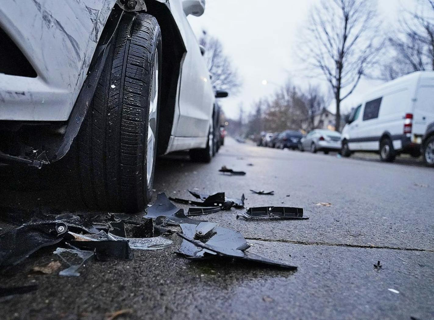 A man was fatally shot in north Minneapolis' Folwell neighborhood on Girard Ave. N. near N. Dowling Ave. early Tuesday, his death pushing the city's homicide total for the year to 77. Here, debris from a parked car that was hit by a vehicle driven by a man who was shot and killed Tuesday in Minneapolis.