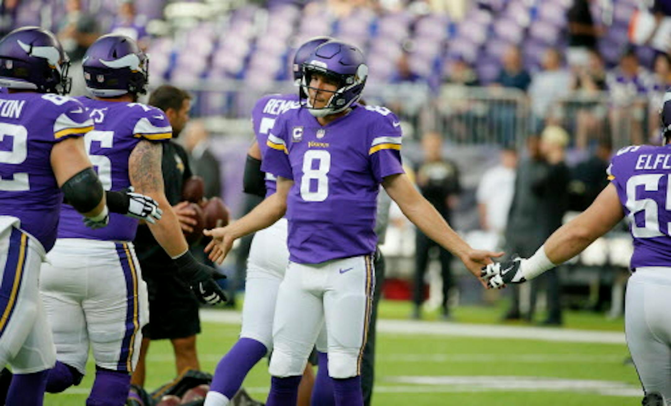 Minnesota Vikings quarterback Sam Bradford (8) greets teammates before an NFL football game against the New Orleans Saints, Monday, Sept. 11, 2017, in Minneapolis. (AP Photo/Bruce Kluckhohn)