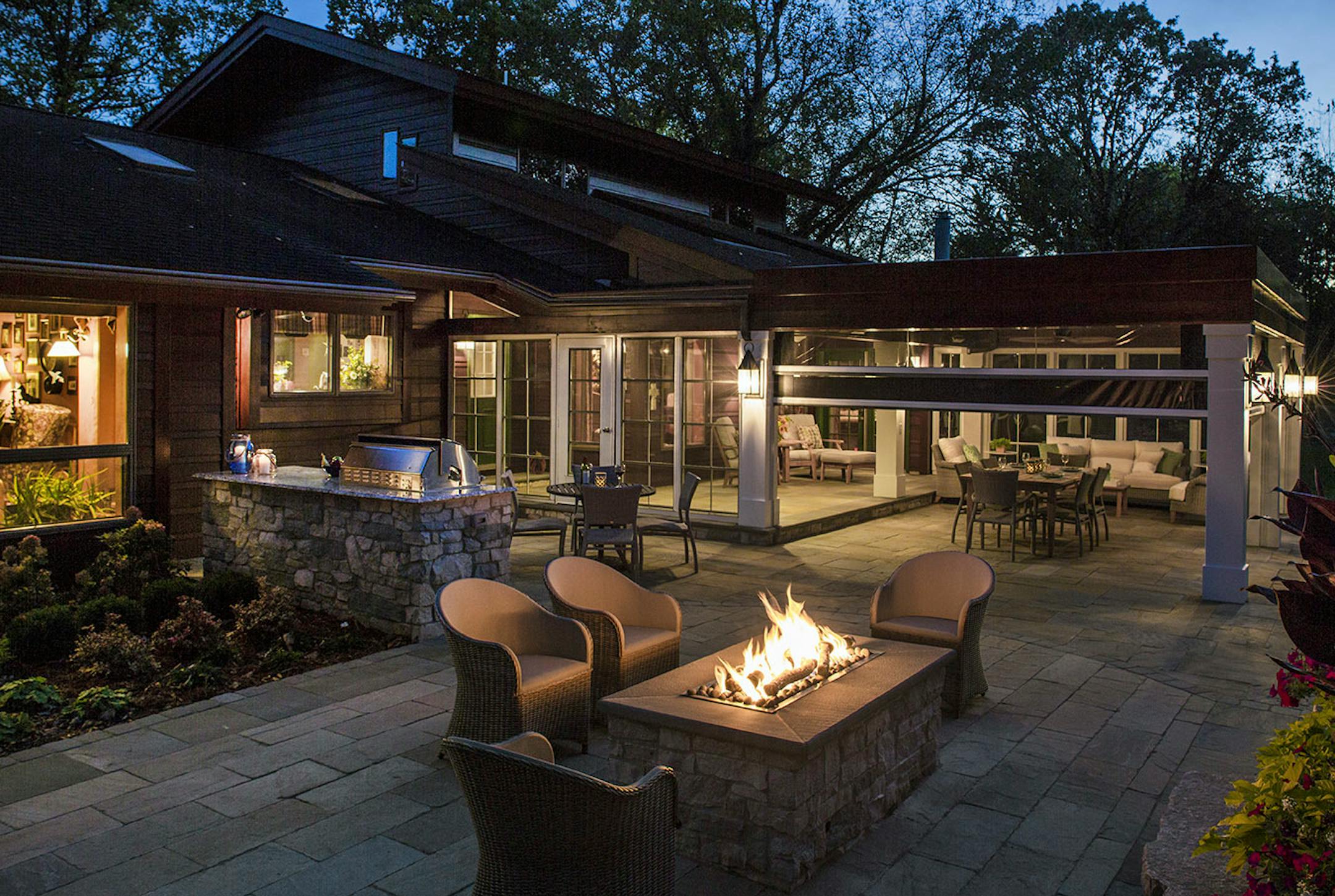Vinyl panels can be lowered to enclose the pergola and keep it comfortable in colder weather.